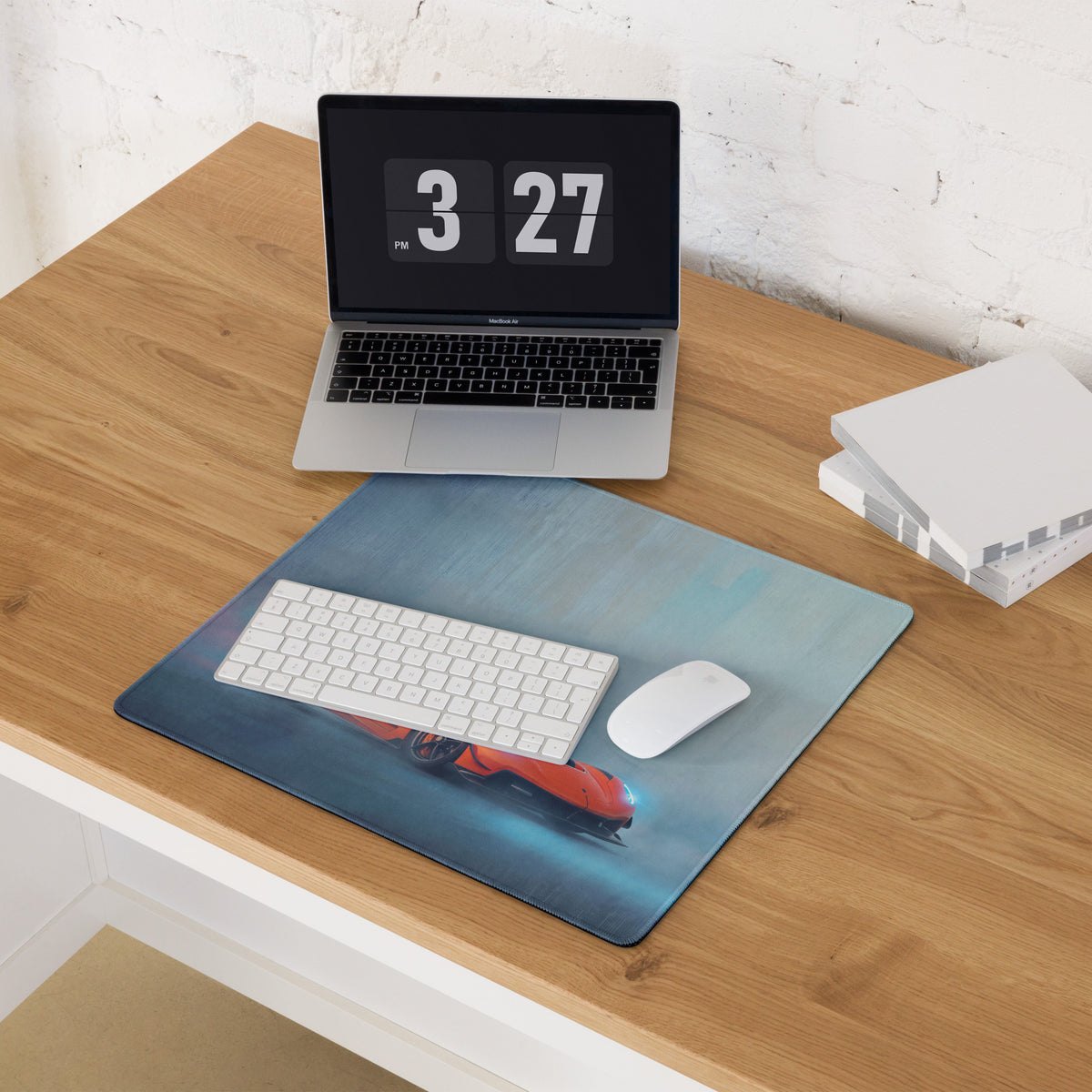 Rectangular koenigsegg jesko inspired tangelo drift desk pad with red sports car print on blue ultra-glide stitched edge surface