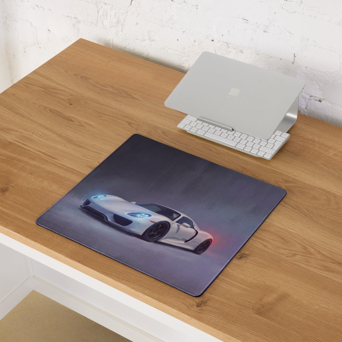 Porsche 918 Spyder inspired pearl white desk pad with stitched edge features white sports car graphic and ultra-glide surface