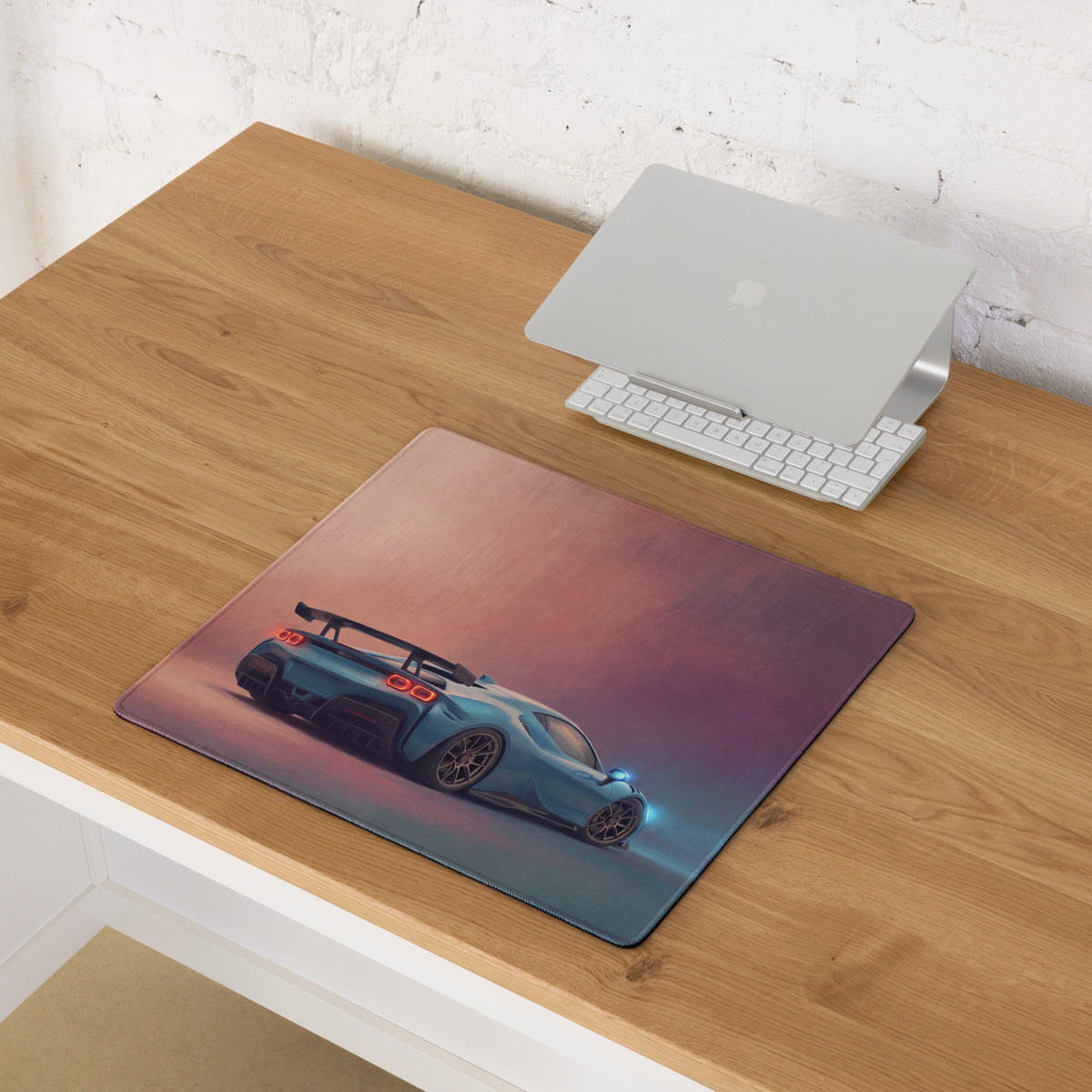 Rectangular low-friction cloth mousepad featuring a teal sports car with glowing red taillights on gradient background