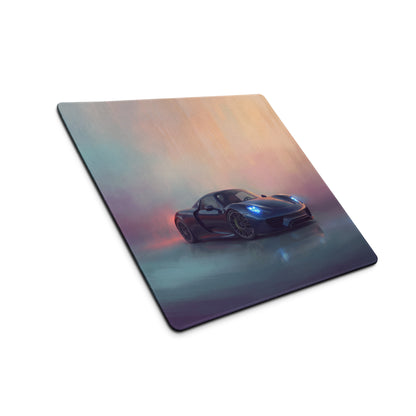 A sleek black Porsche 918 Spyder inspired midnight blue desk pad with glowing blue headlights on a soft purple orange gradient