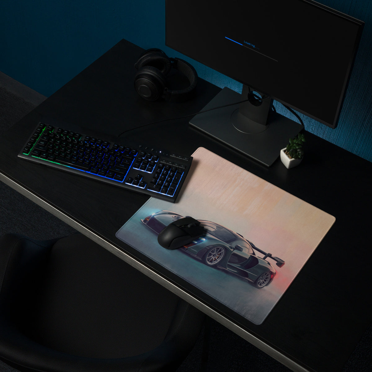 A sleek rectangular low-friction cloth mousepad in British racing green featuring a dark gray McLaren Senna graphic with blue accents