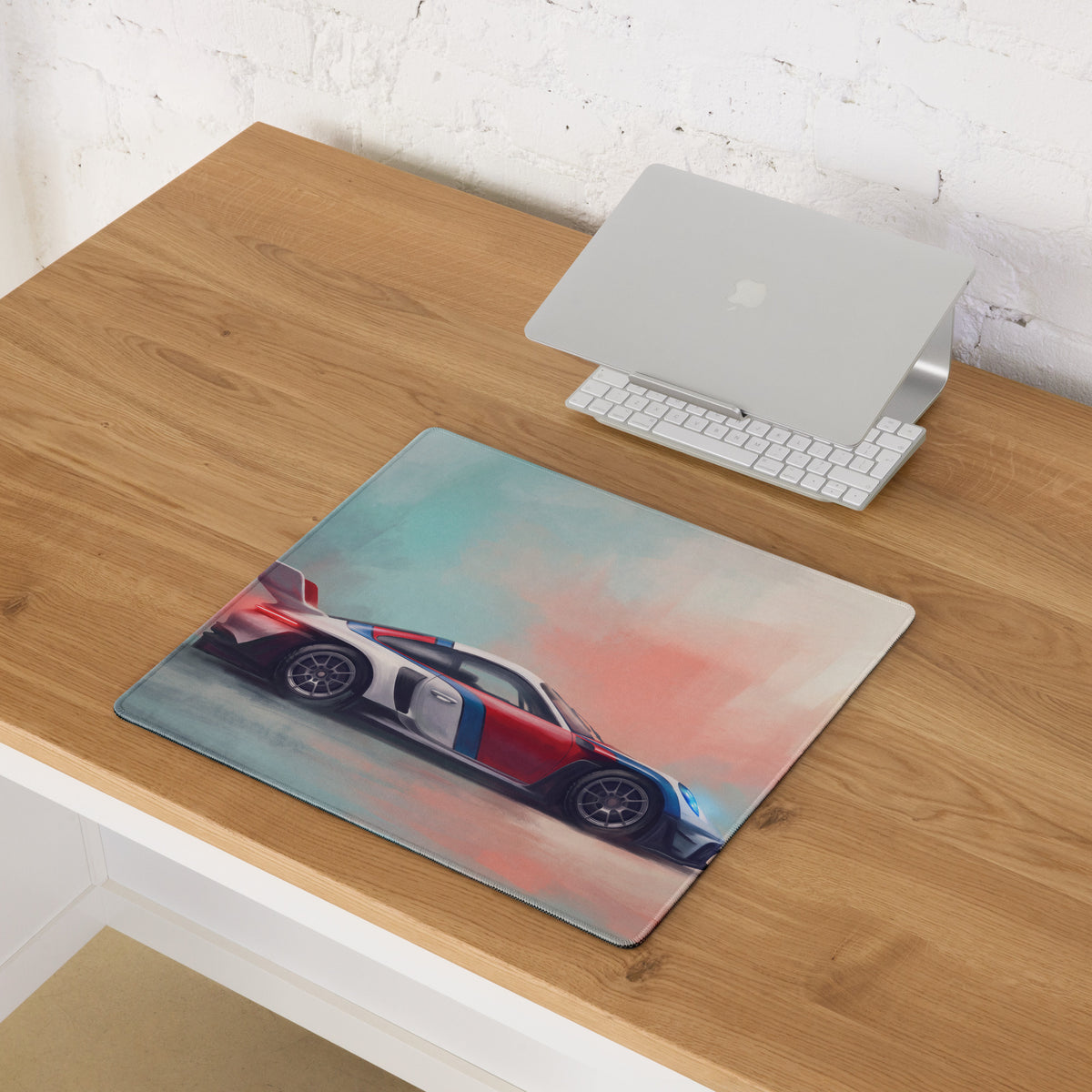 Rectangular low-friction cloth desk mat with vibrant red white and blue porsche 911 inspired racing car illustration