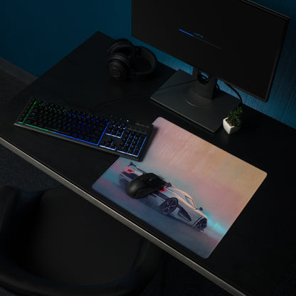 A sleek xl gaming mousepad featuring a vibrant white koenigsegg hypercar graphic with blue and pink accents