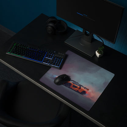Rectangular non-slip mousepad featuring an orange mclaren senna inspired sports car graphic with smoky gray and pink background