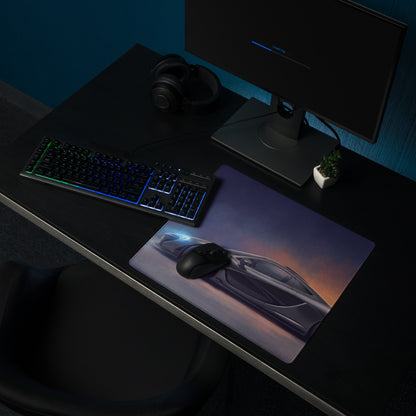 A sleek charcoal gaming mousepad featuring a vibrant futuristic mclaren p1 sports car graphic under twilight sky