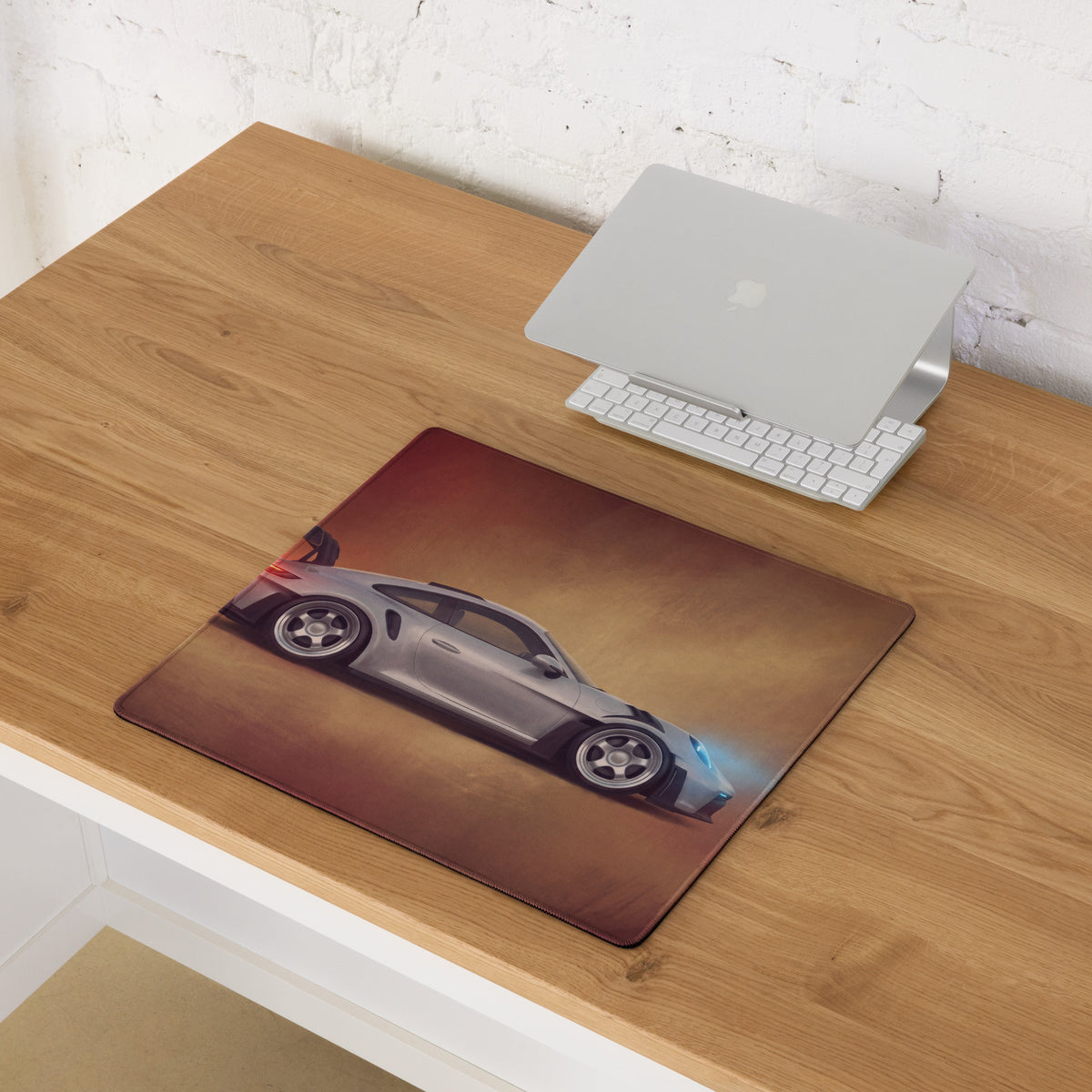 Silver porsche 911 gt3 rs inspired sports car graphic printed on brown leather desk pad with stitched edge