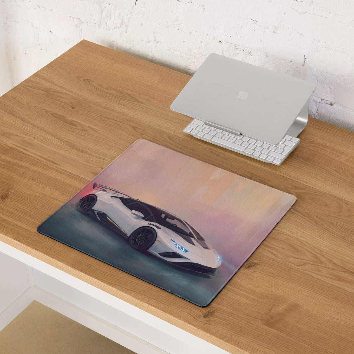 A rectangular Lamborghini huracán inspired pearl tricolore desk pad with a vibrant white sports car print and stitched edges