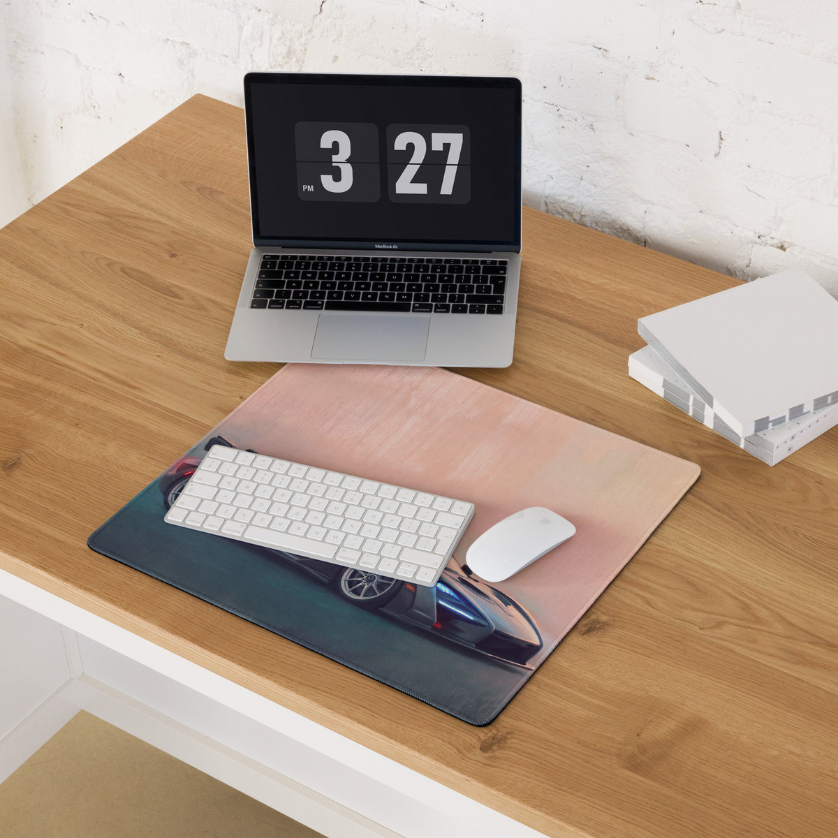 Rectangular carbon stealth desk mat with blue mclaren senna sports car on pink and teal gradient for gaming use