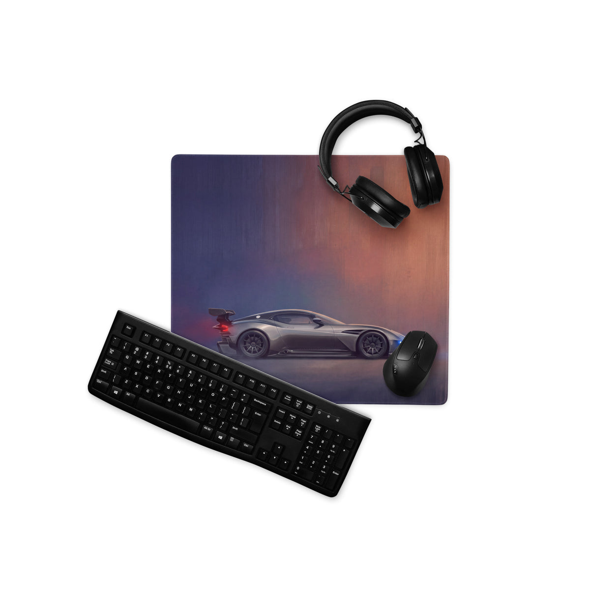 Aston Martin Vulcan inspired charcoal stealth desk pad with gray sports car graphic and stitched edge for gaming use