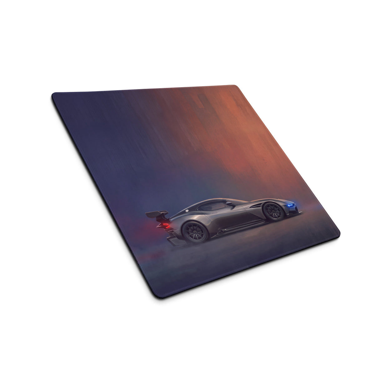 Aston Martin Vulcan inspired charcoal stealth desk pad with a sleek dark gray racing car and glowing blue red accents