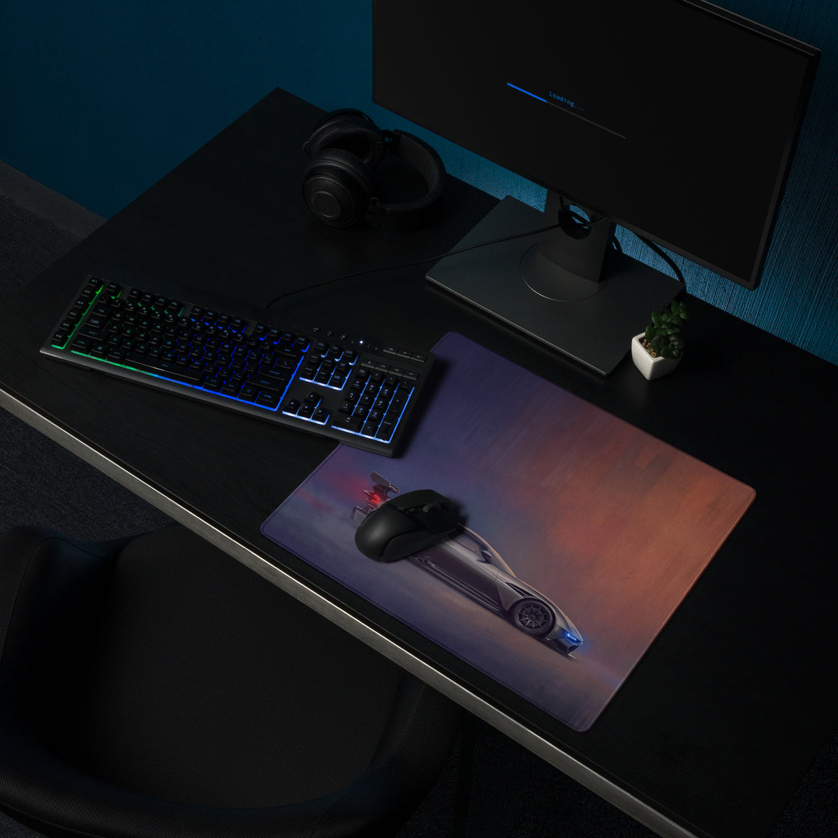 Aston Martin Vulcan inspired charcoal stealth desk pad with ultra-glide stitched edge featuring a futuristic silver sports car graphic