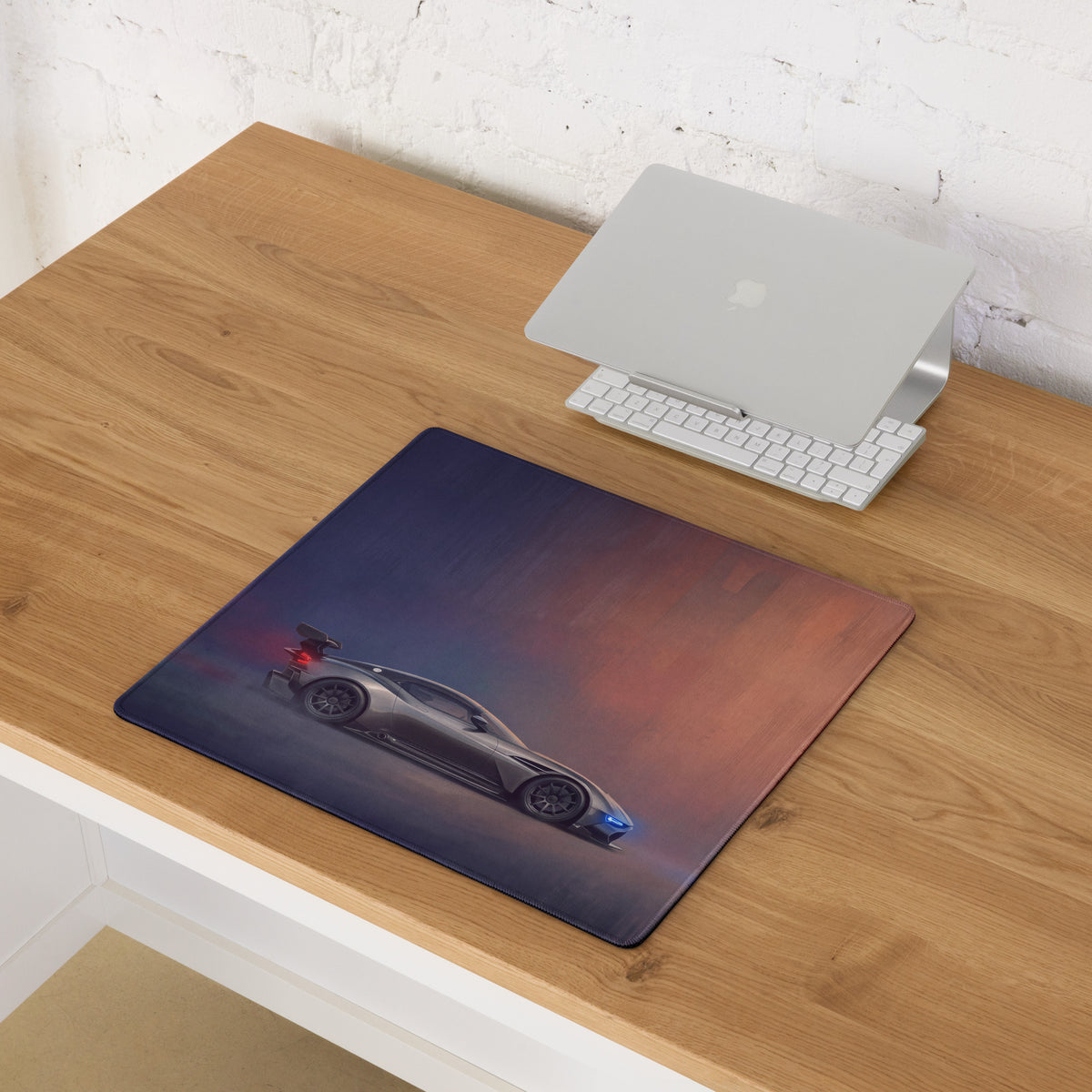 Aston Martin Vulcan inspired charcoal stealth desk pad with ultra-glide stitched edge and silver sports car print