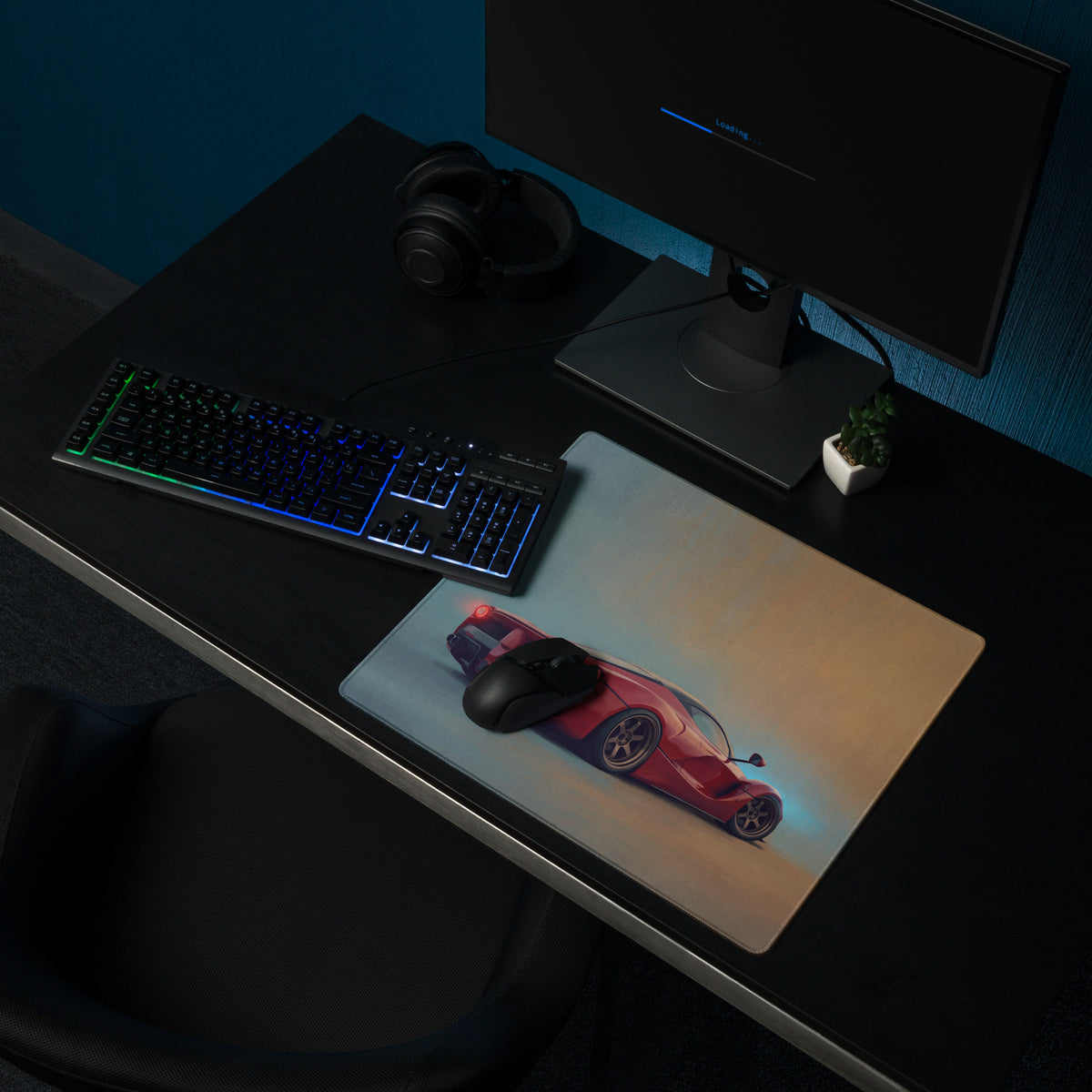 A sleek rectangular low-friction cloth gaming mousepad featuring a vibrant red ferrari laferarri inspired sports car design with blue accents