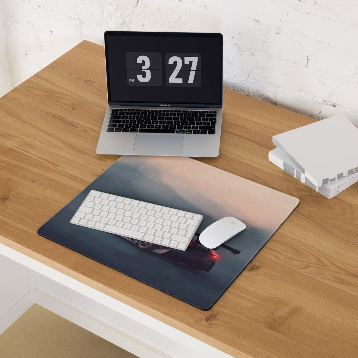 A sleek rectangular onyx track desk mat featuring an aston martin vulcan inspired car image in dusk colors
