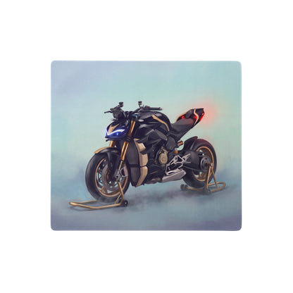 Black and gold ducati streetfighter v4-inspired extended desk mat with glowing blue headlights and red taillights illustration