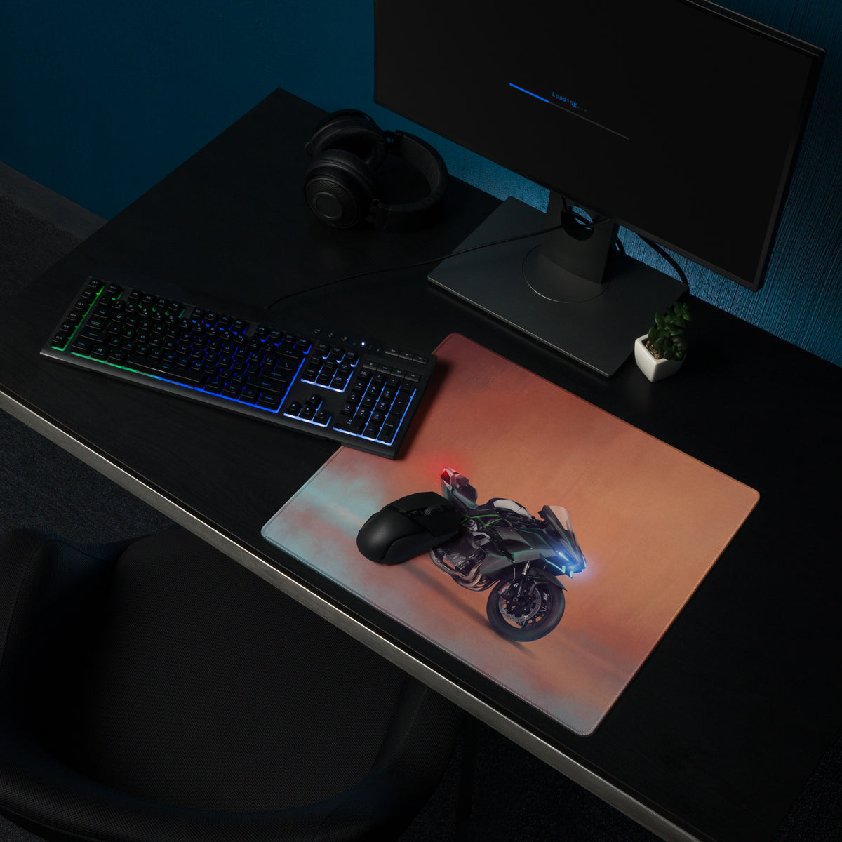 A sleek rectangular gaming mousepad with a futuristic motorcycle graphic in blue red on an orange gradient background