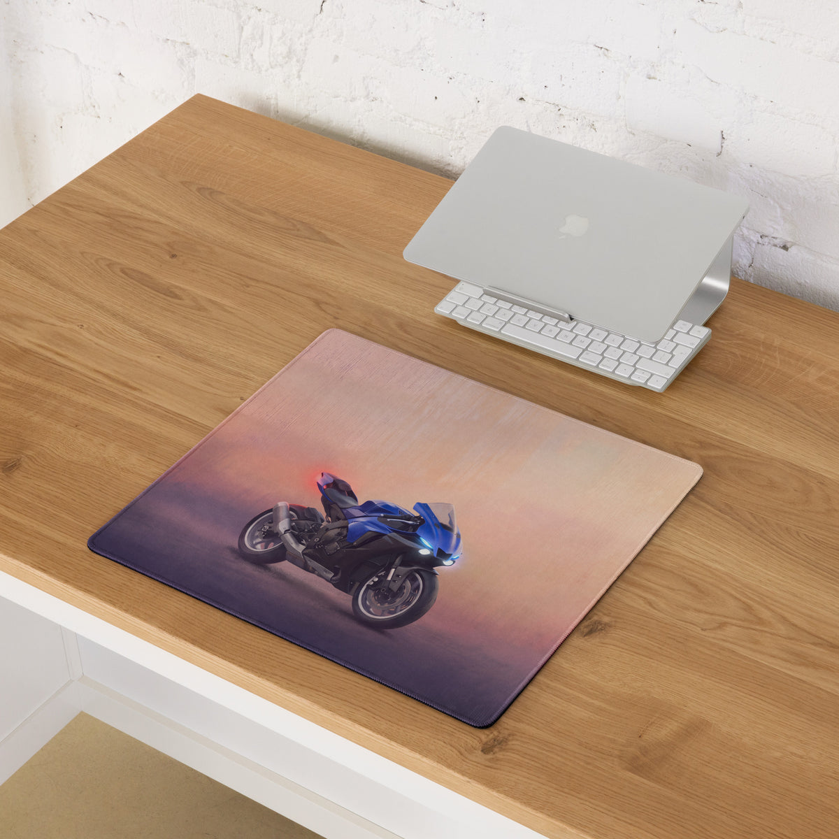 Blue yamaha yzf-r1 inspired extended desk mat with smooth stitched edges and gradient sunset background for gamers