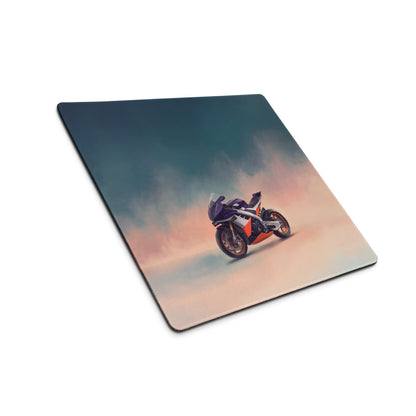 Square mousepad with vibrant purple and orange Aprilia RSV4 Xtrenta racing motorcycle graphic and stitched edges