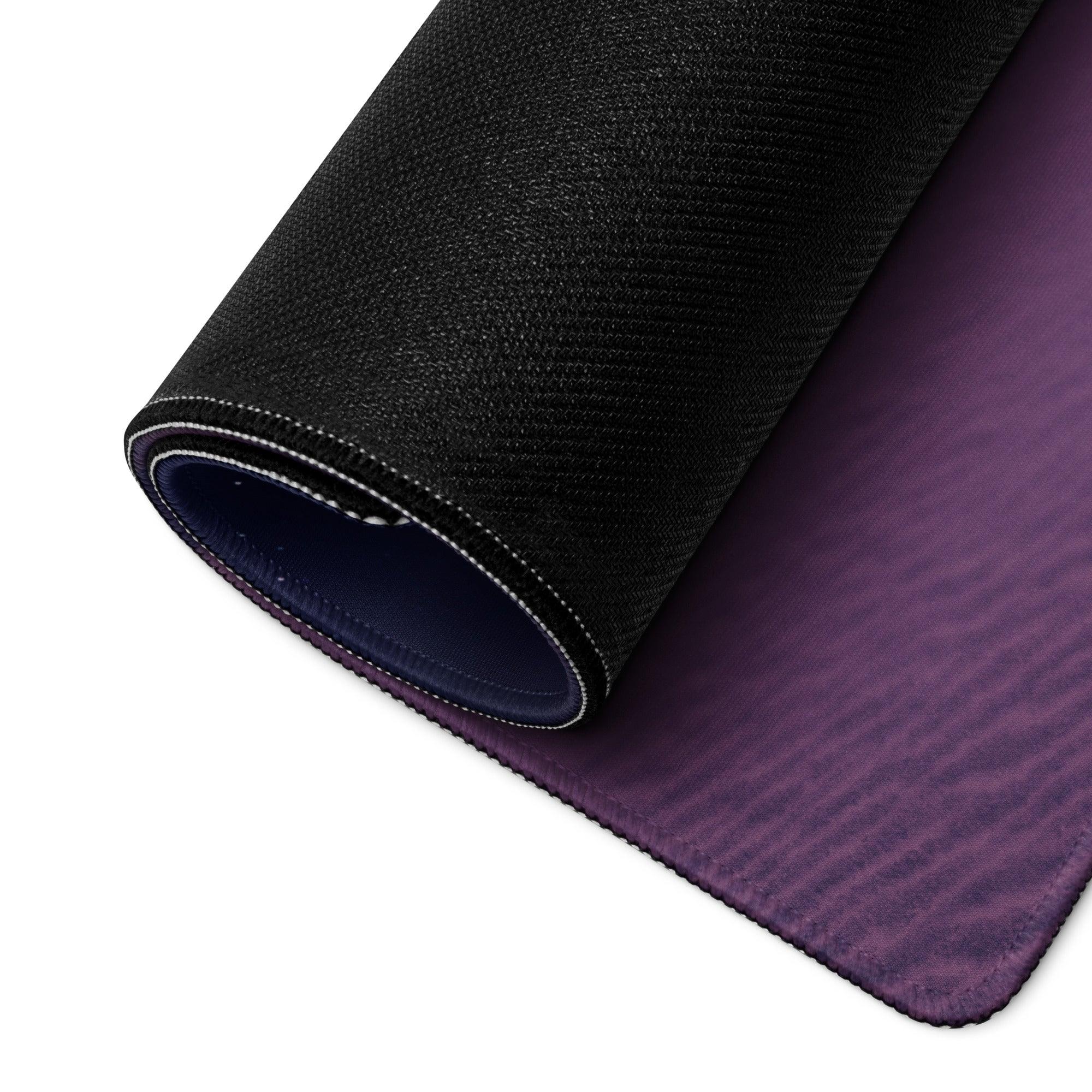 Rolled-up Dreamy Purple Sunset gaming mouse pad with stitched edges