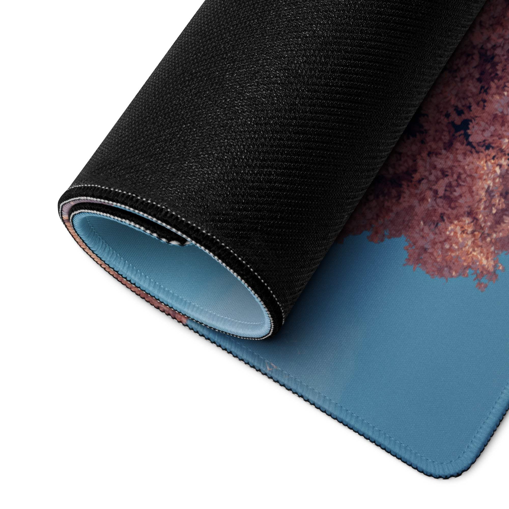 Dreamy pink tree landscape gaming mouse pad, black blue textured surface