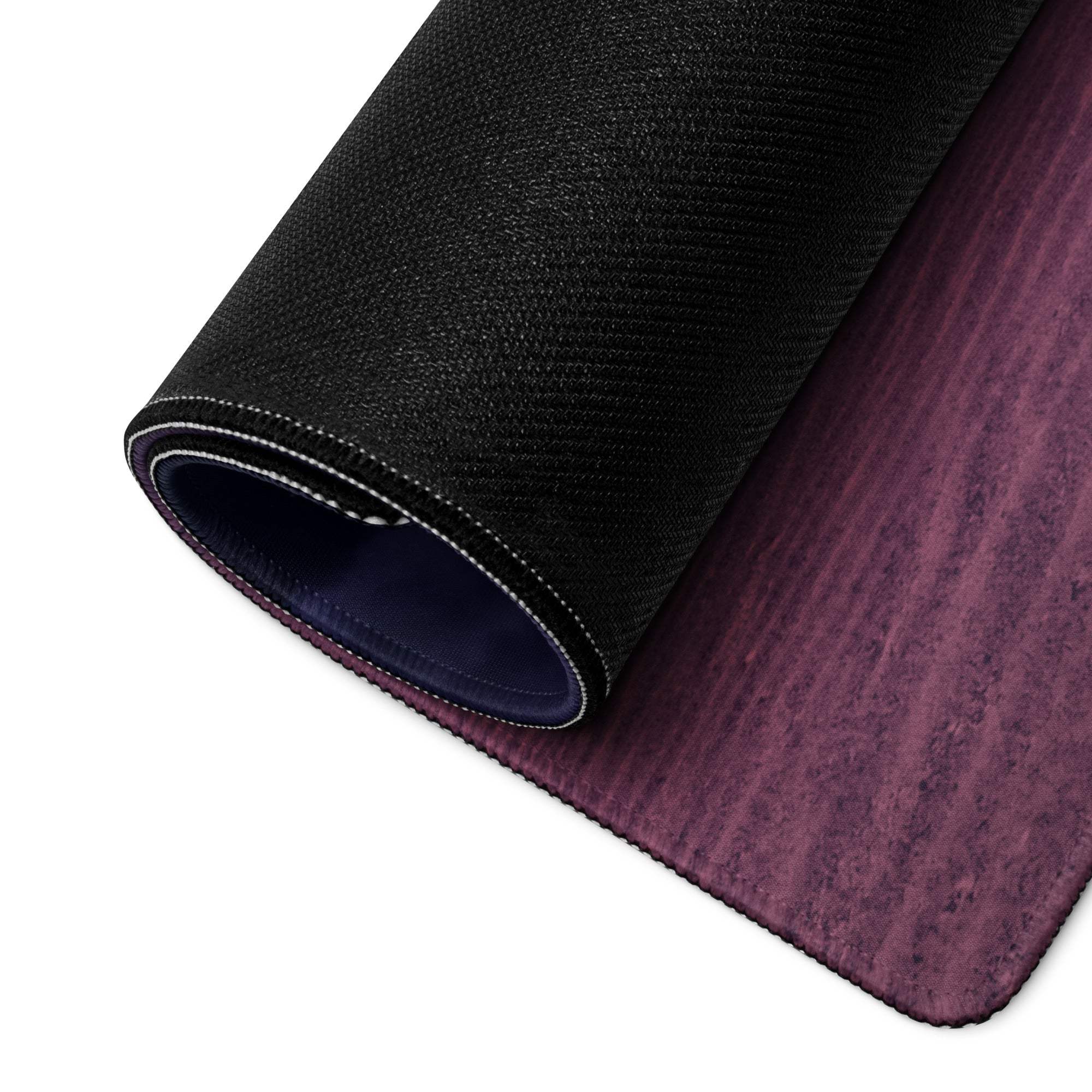 Black and purple gradient yoga mat with textured surface and stitched edges