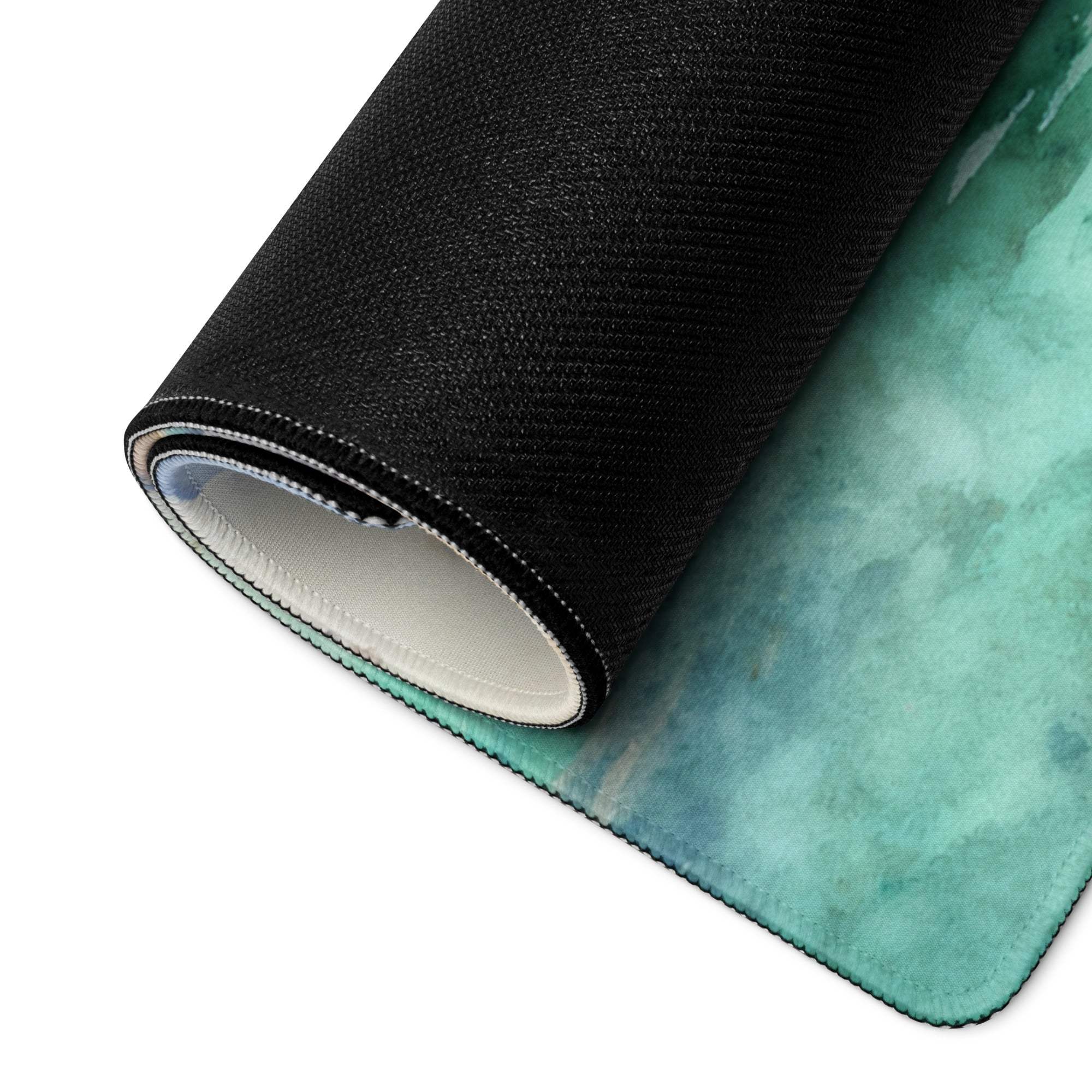 Rolled watercolor tropical island gaming mouse pad with teal gradient, non-slip backing