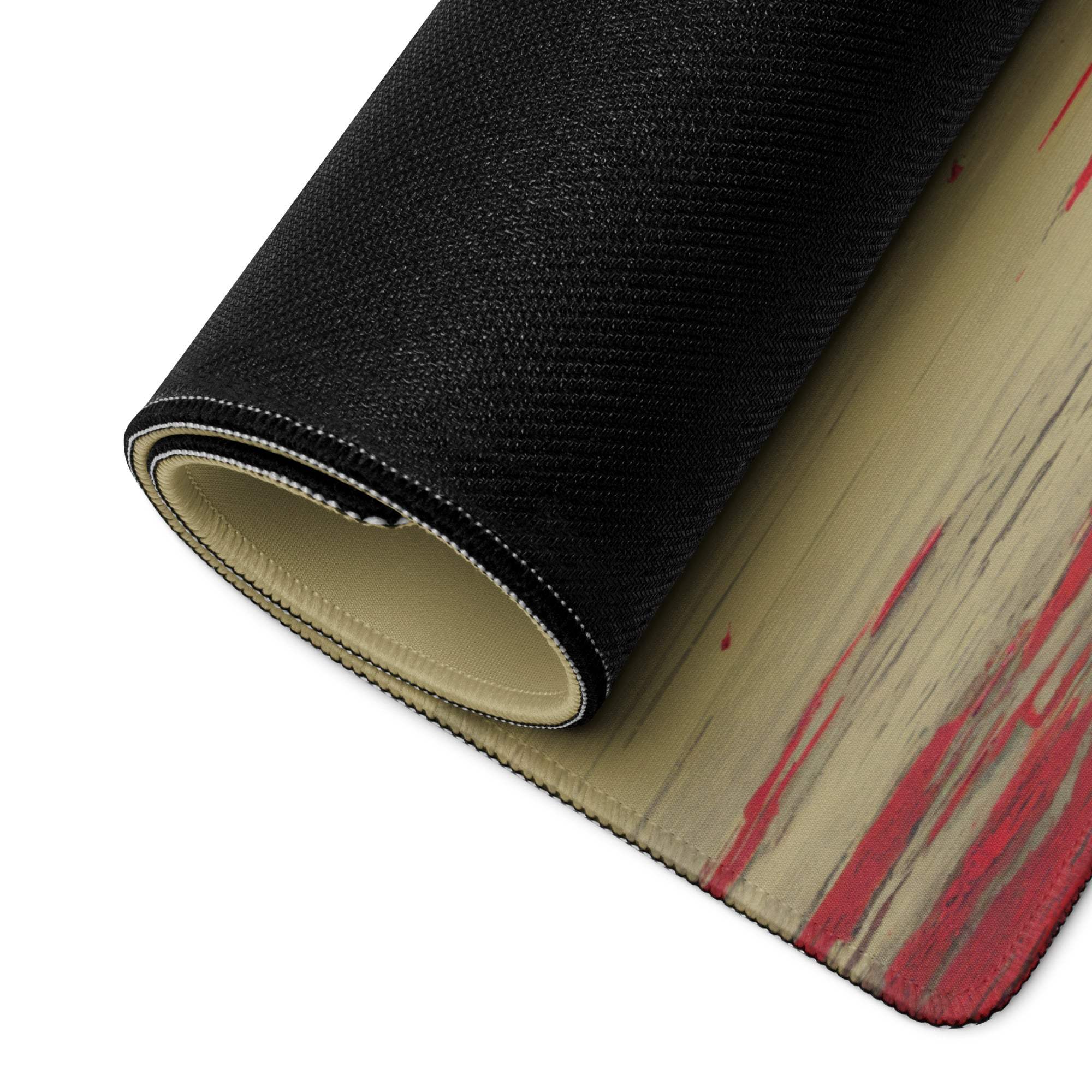 Black and beige gaming mouse pad with red paint splatter and dreamlike red moon design