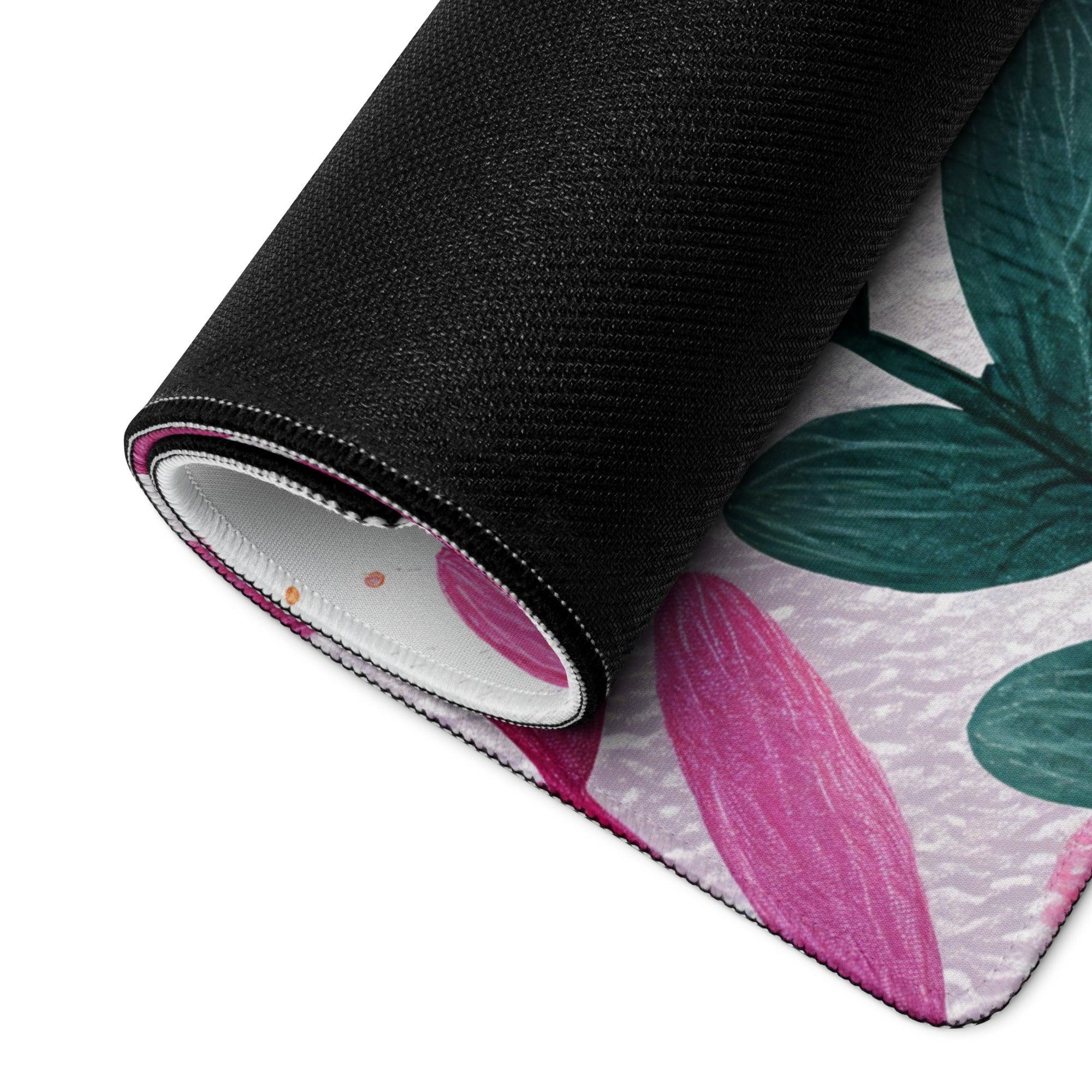 Rolled vibrant pink green botanical rug in black fabric for large gaming mouse pad