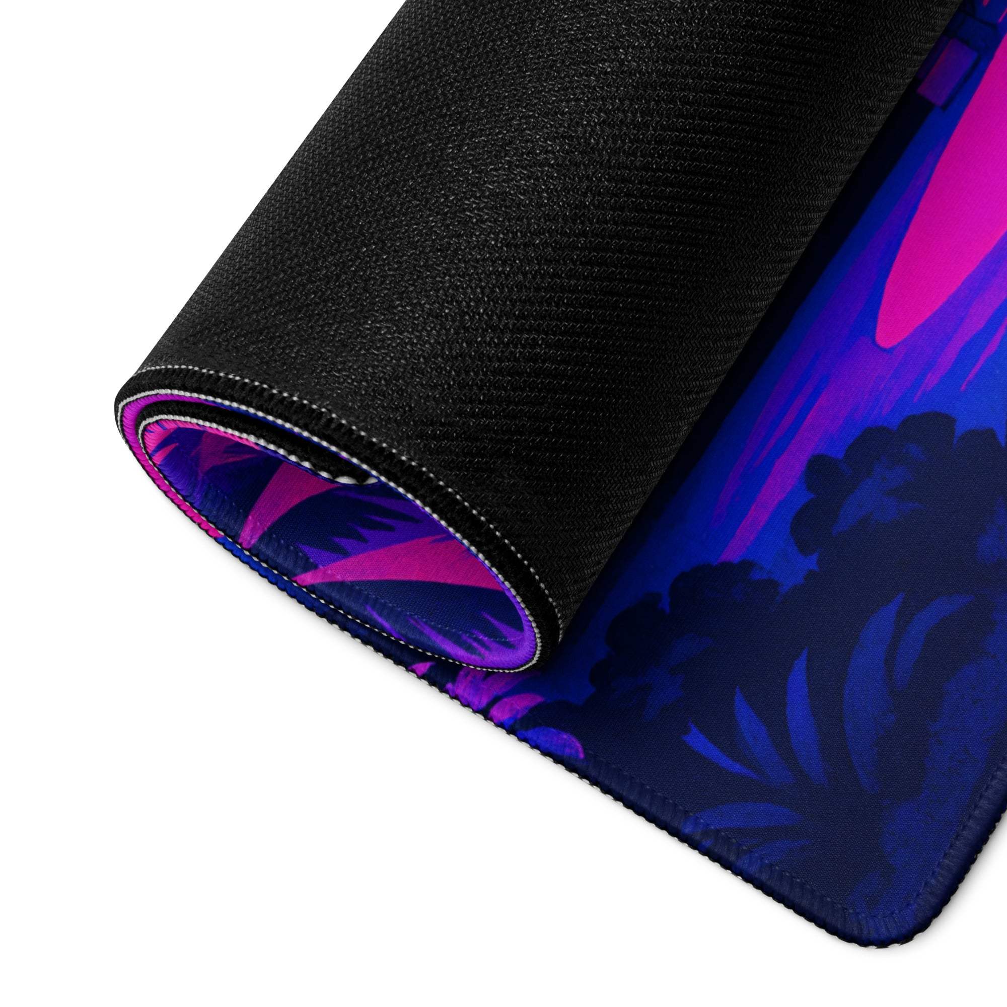 Rolled-up Vaporwave Neon Sunset Mansion gaming mouse pad with purple pink tropical leaves