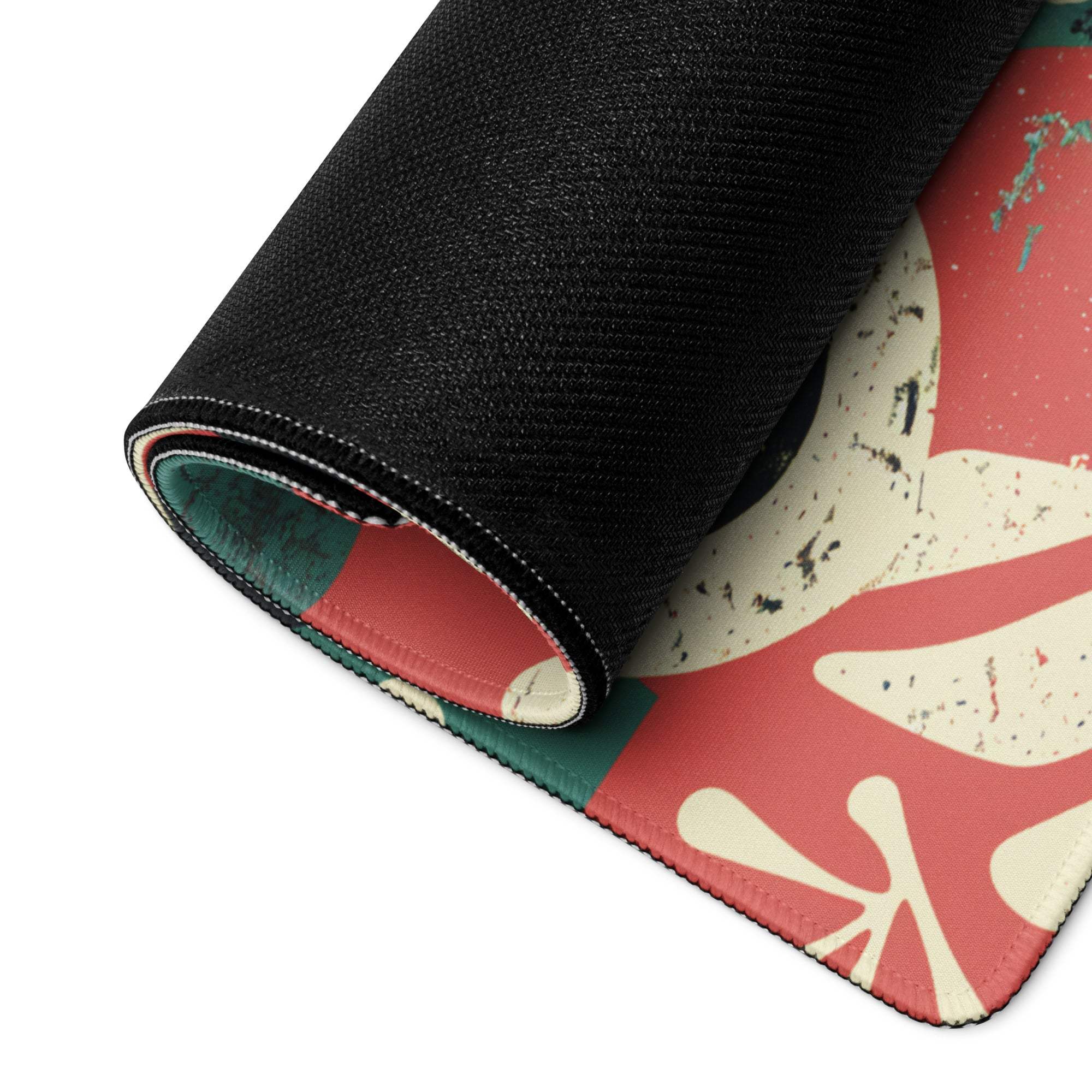 Vibrant floral abstract gaming mouse pad rolled up with non-slip base