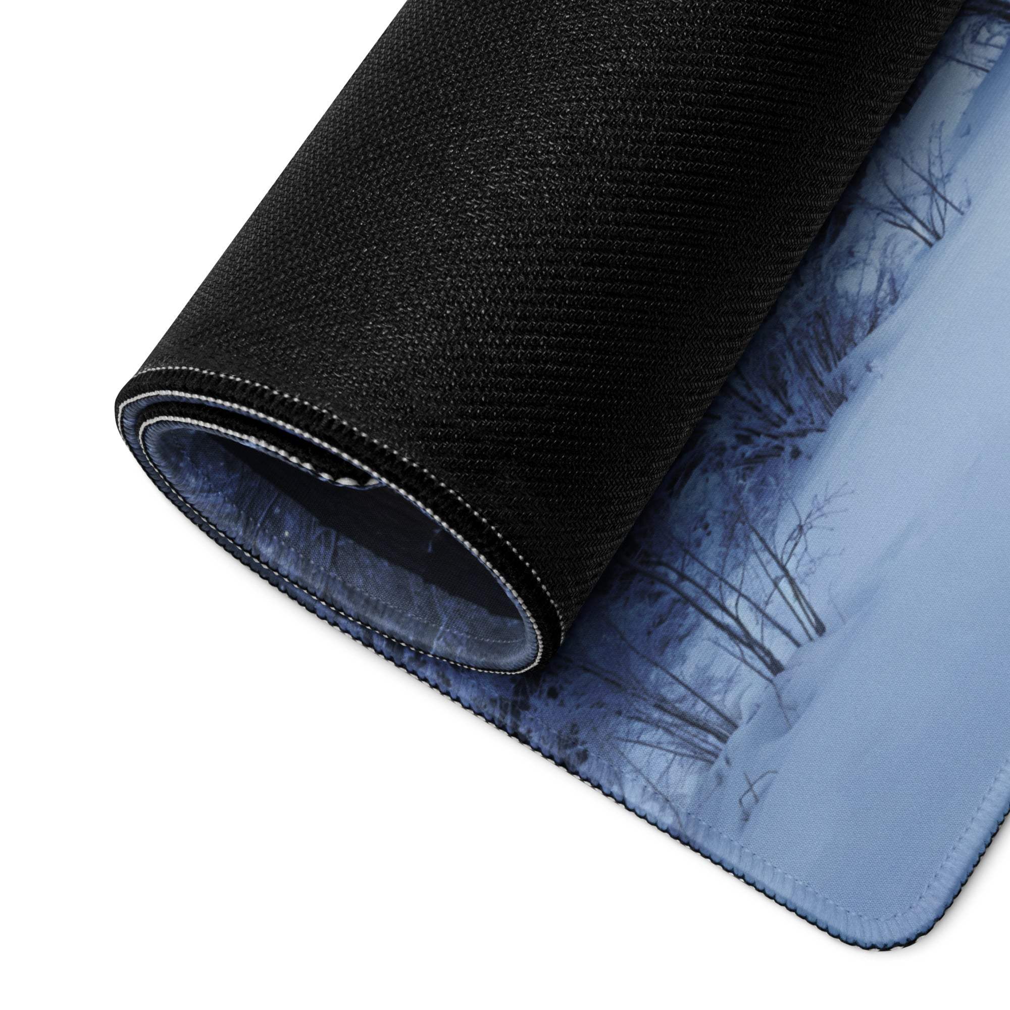 Black textured large gaming mousepad with blue winter forest design