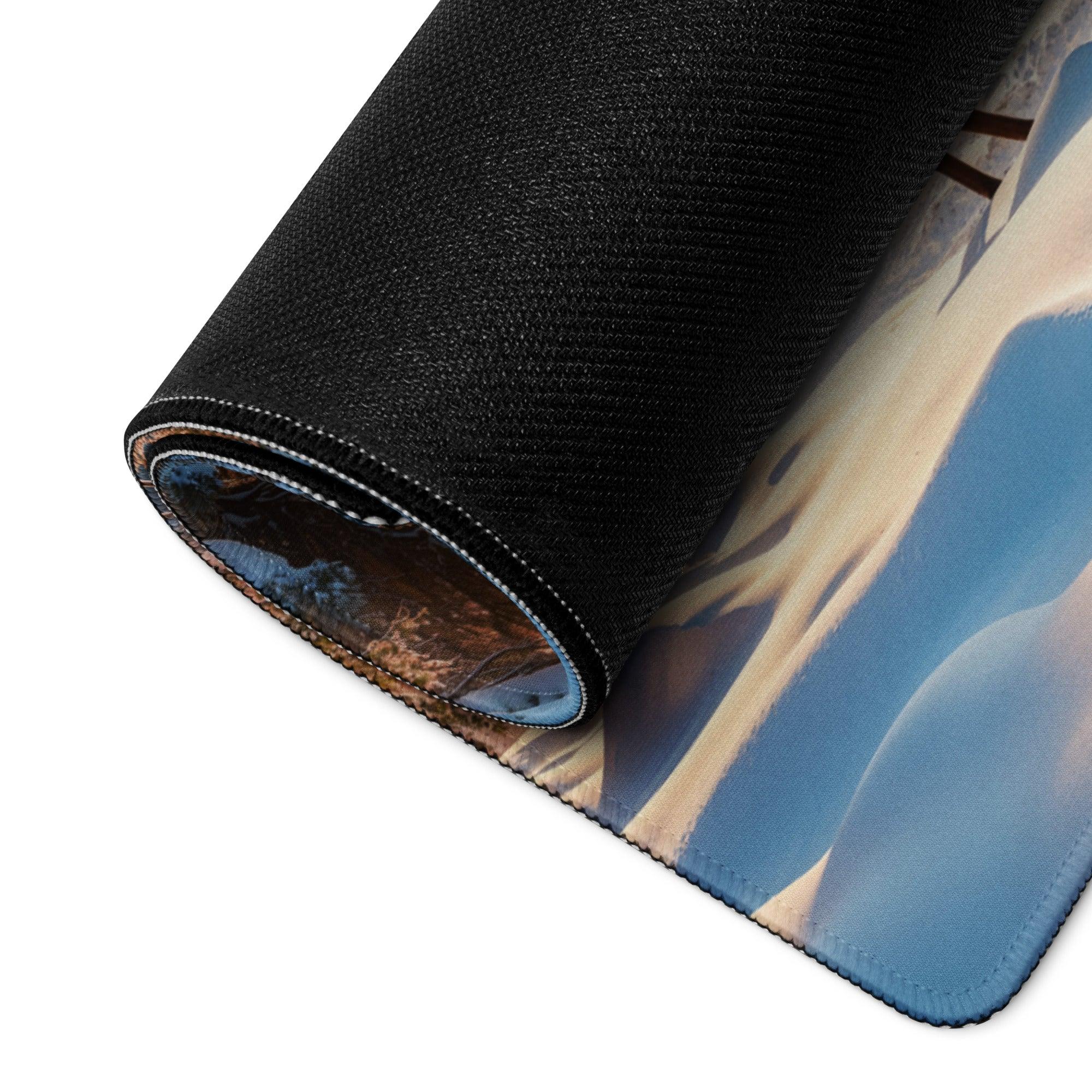 Black textured mousepad with desert dunes, blue skies, golden sand
