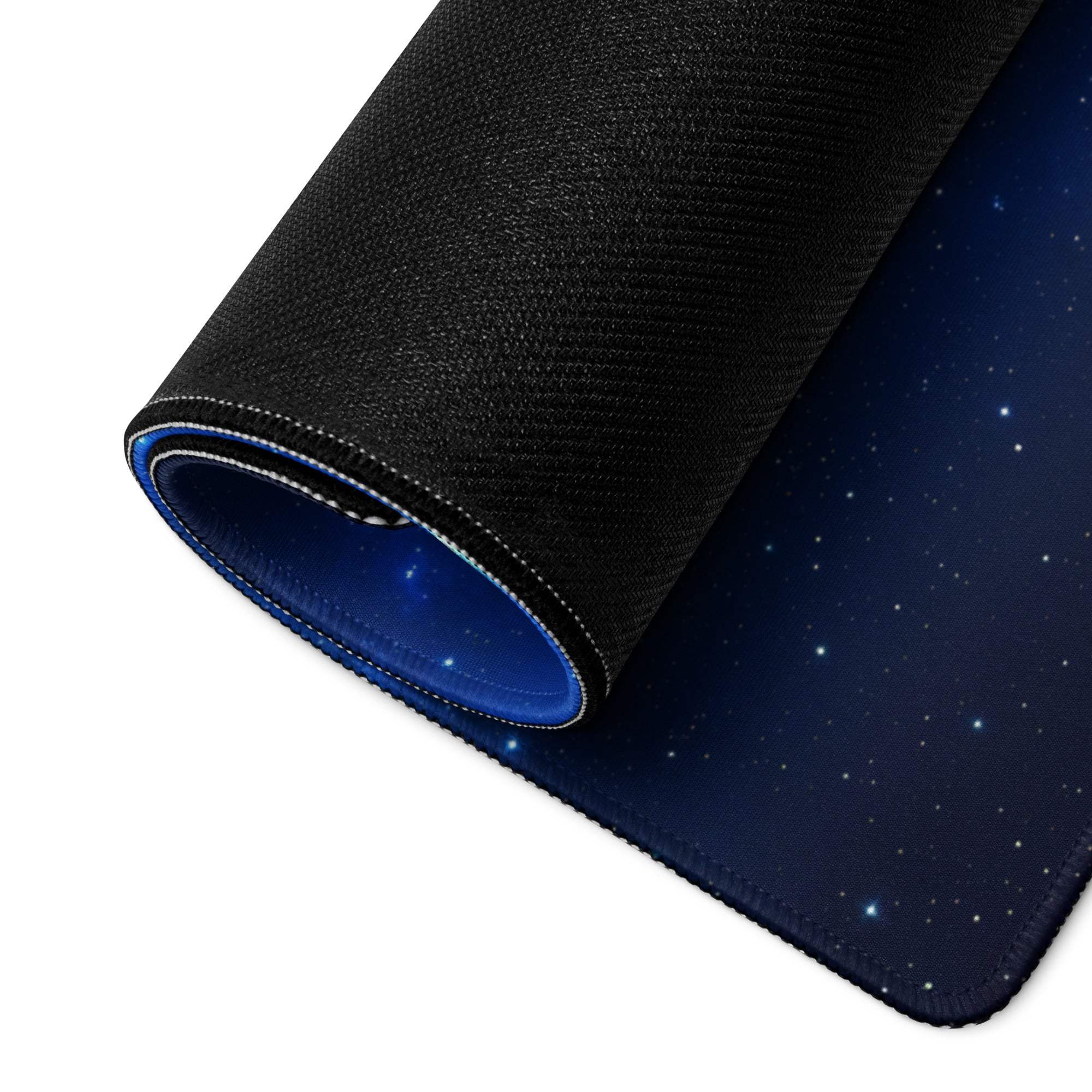 Sleek cosmic blue galaxy gaming mouse pad with starry texture, white edge stitching