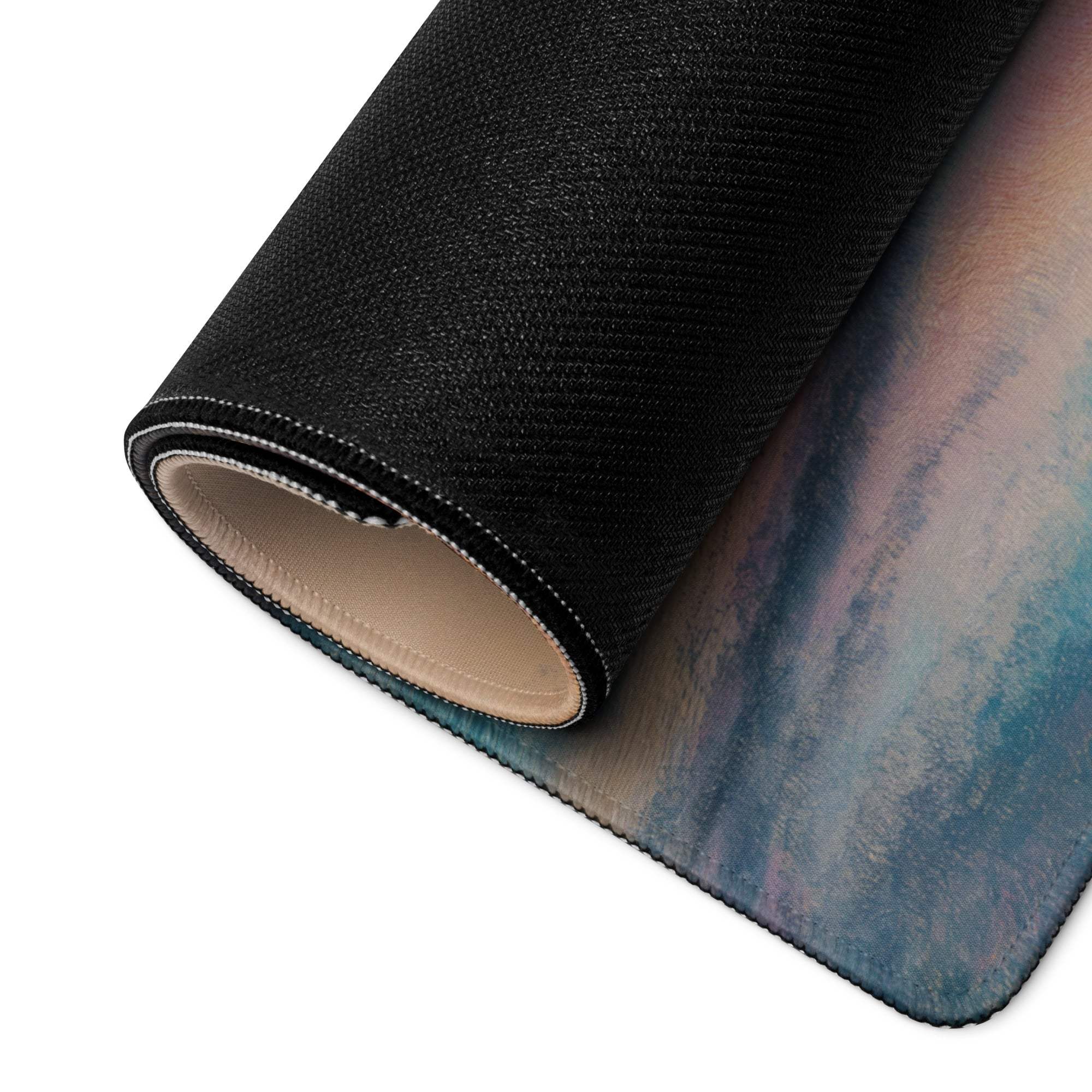 Rolled-up Pastel Sunset large gaming mouse pad with gradient blues, purples, pinks