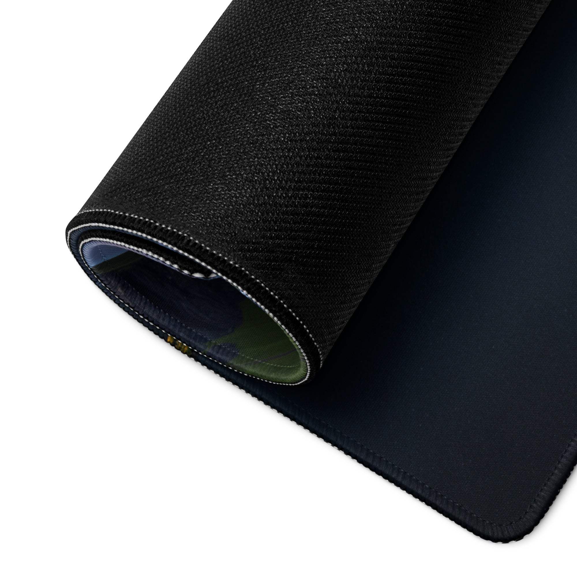 Black textured back of Vibrant Sunset gaming mouse pad with stitched edges