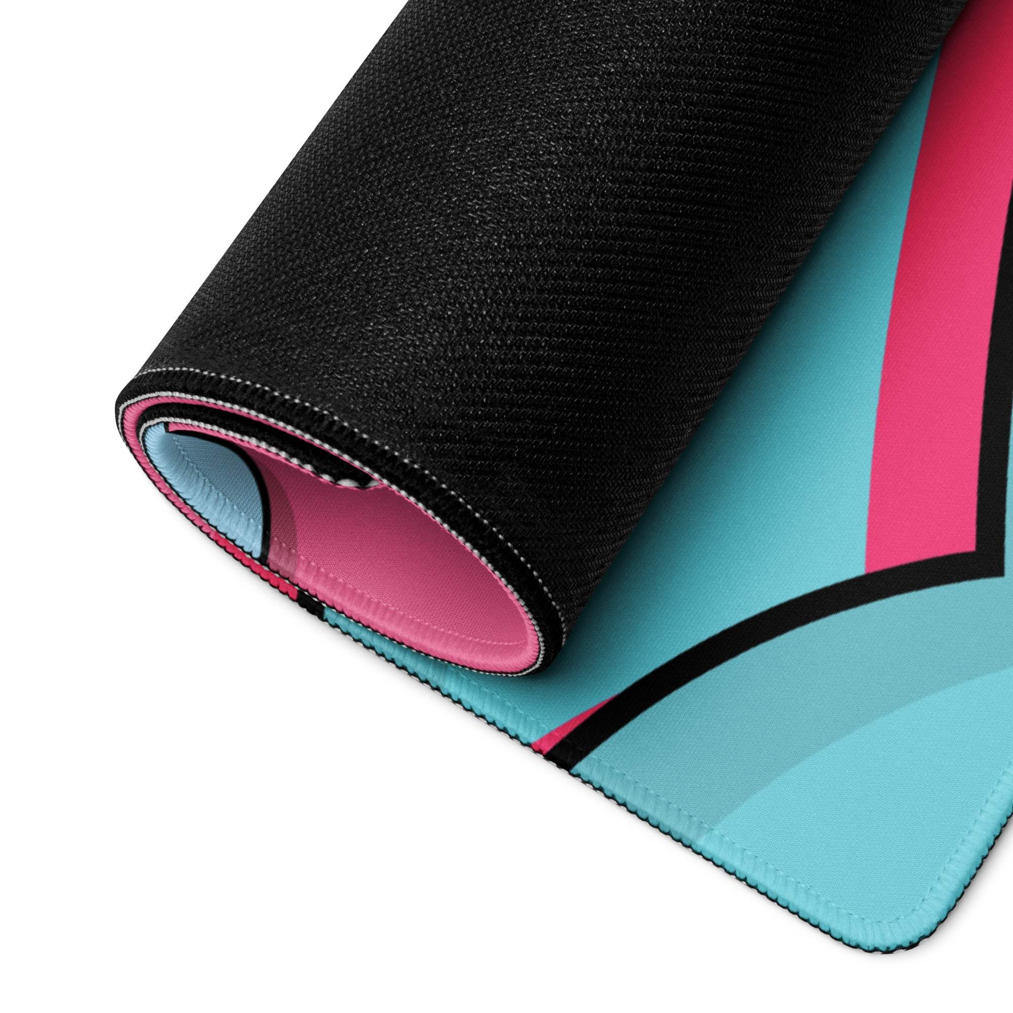 Rolled-up Whimsical Cartoon Landscape gaming mouse pad in turquoise pink with black trim