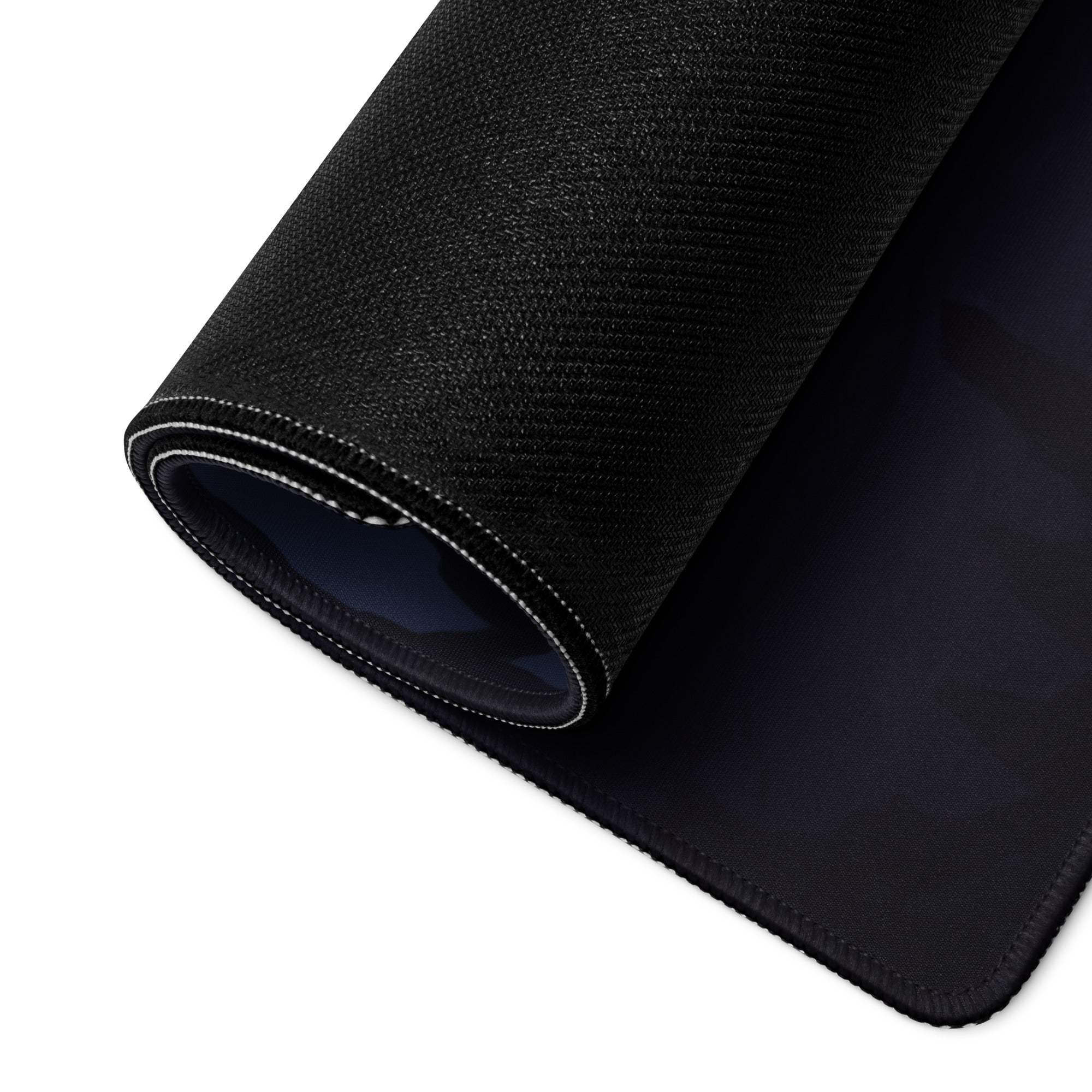 Black textured back of Blue Fantasy Landscape gaming mouse pad with stitched edges