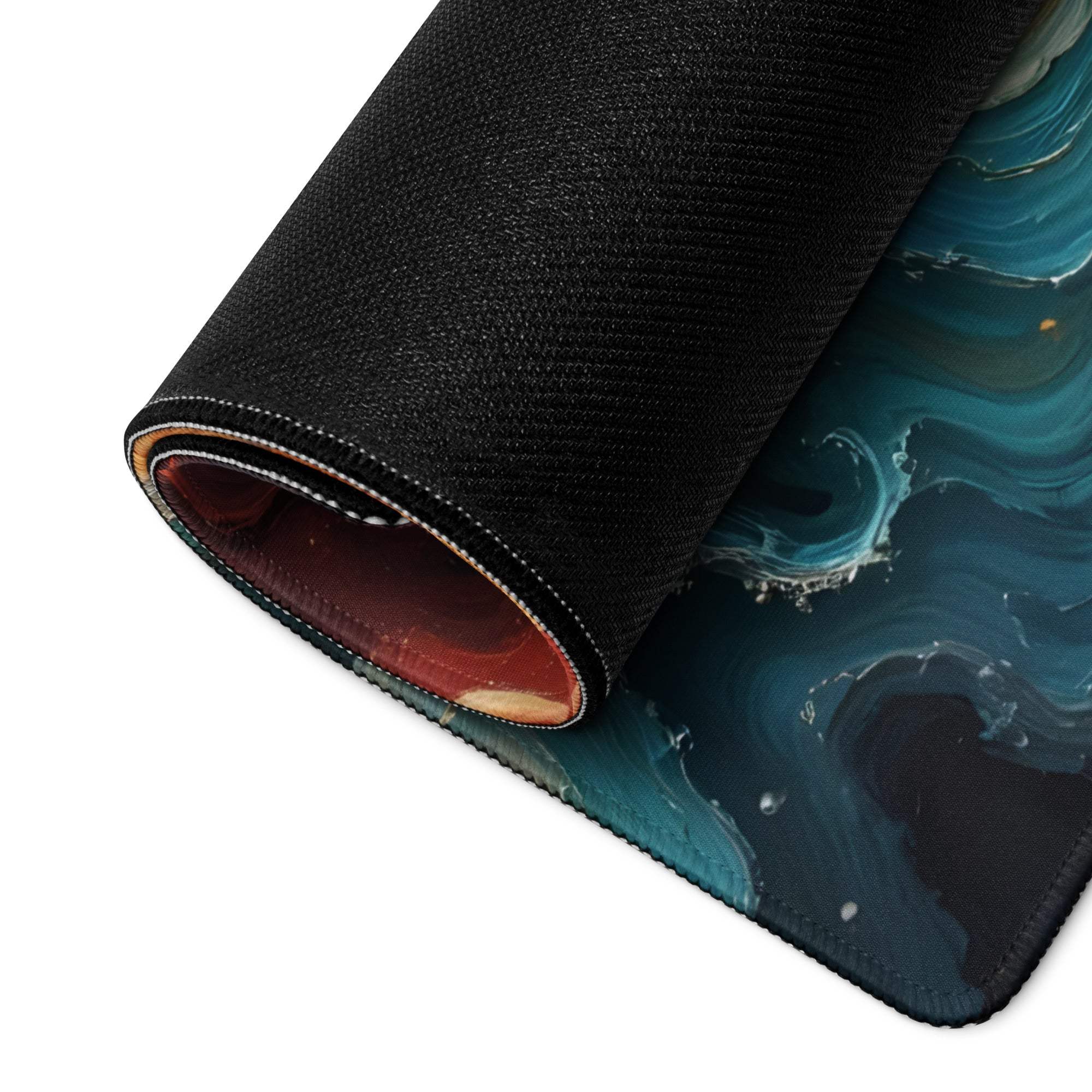 Rolled-up large gaming mouse pad with abstract swirl ocean sunset teal marbled design