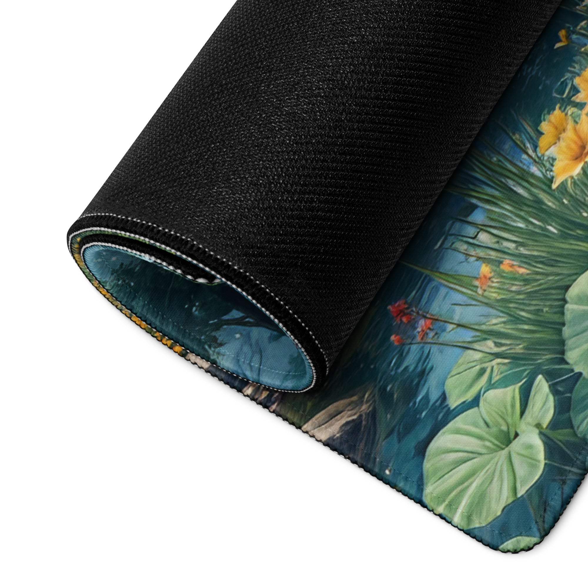 Rolled-up large gaming mouse pad with yellow flowers, lily pads, teal water, edge stitching, non-slip base