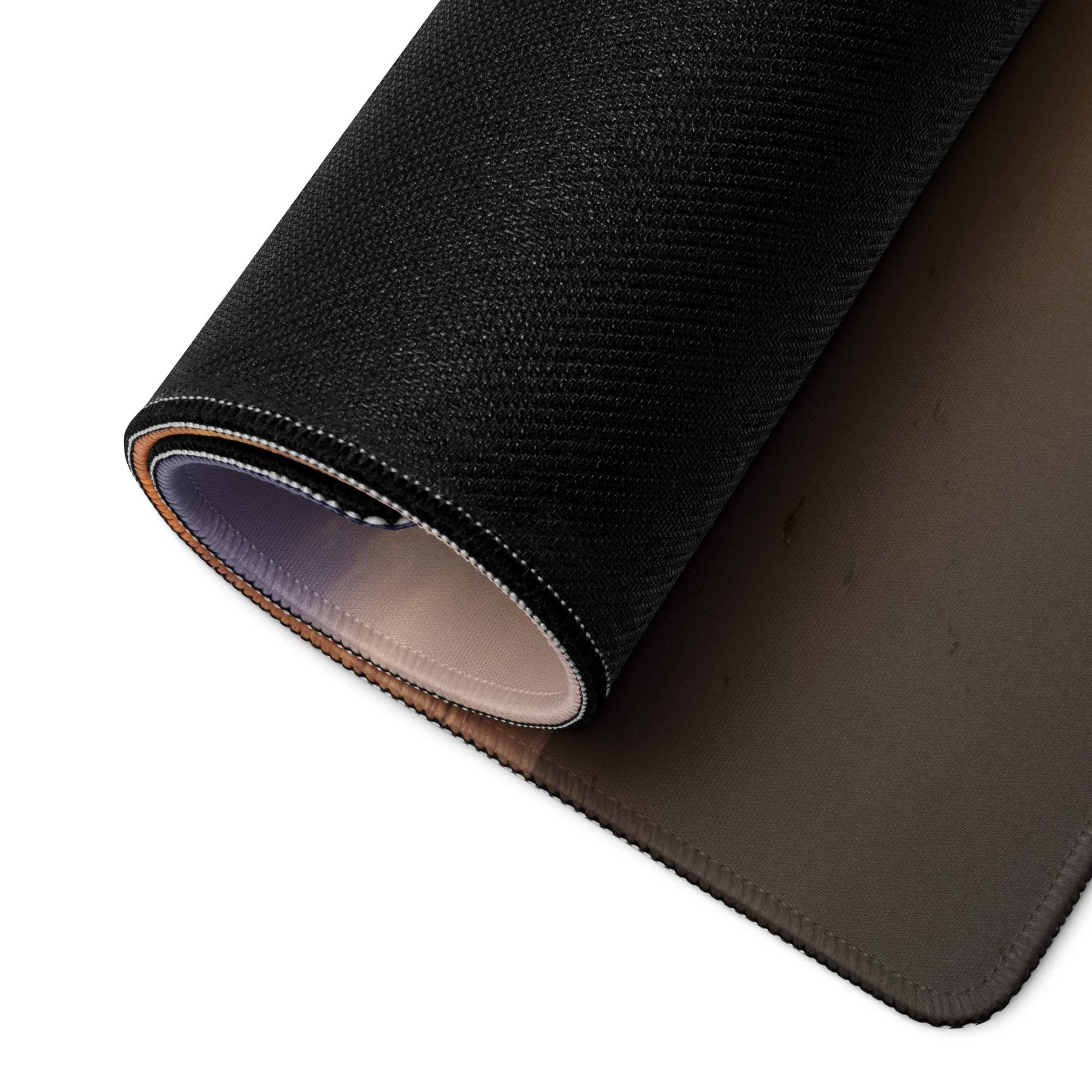 Back of large tropical sunset beach gaming mouse pad with black textured top, smooth dark gray underside and stitched edges