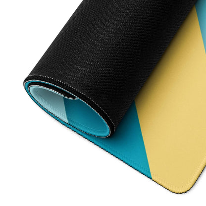 Rolled-up geometric teal blue yellow gaming mouse pad with stitched edges