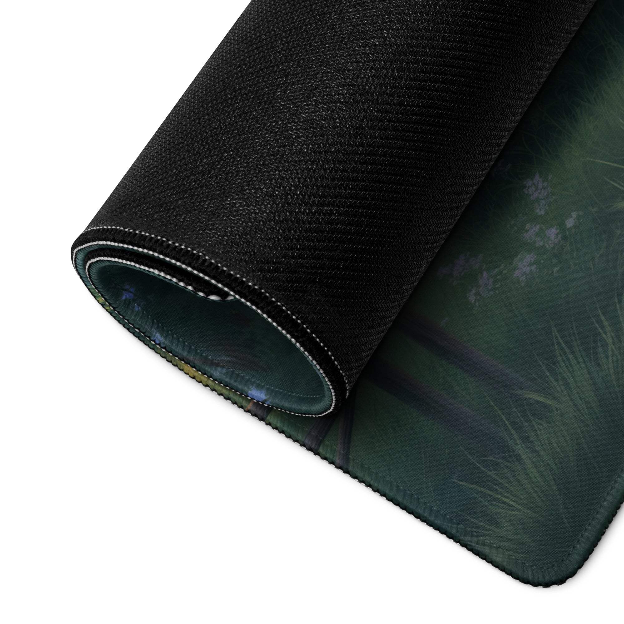 Black textured mousepad with dark green grassy landscape design