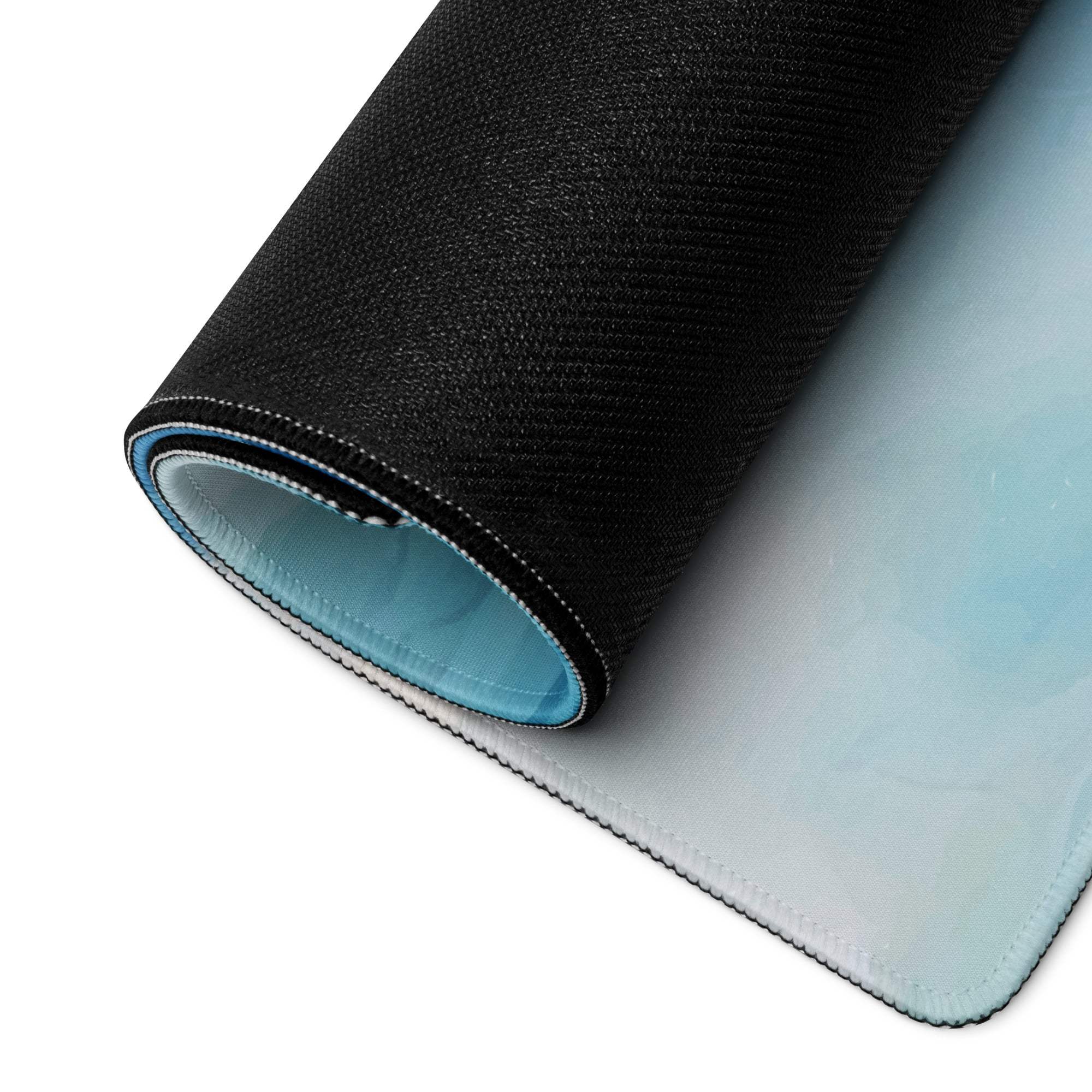 Black textured mousepad with light blue ocean wave gradient, stitched edges
