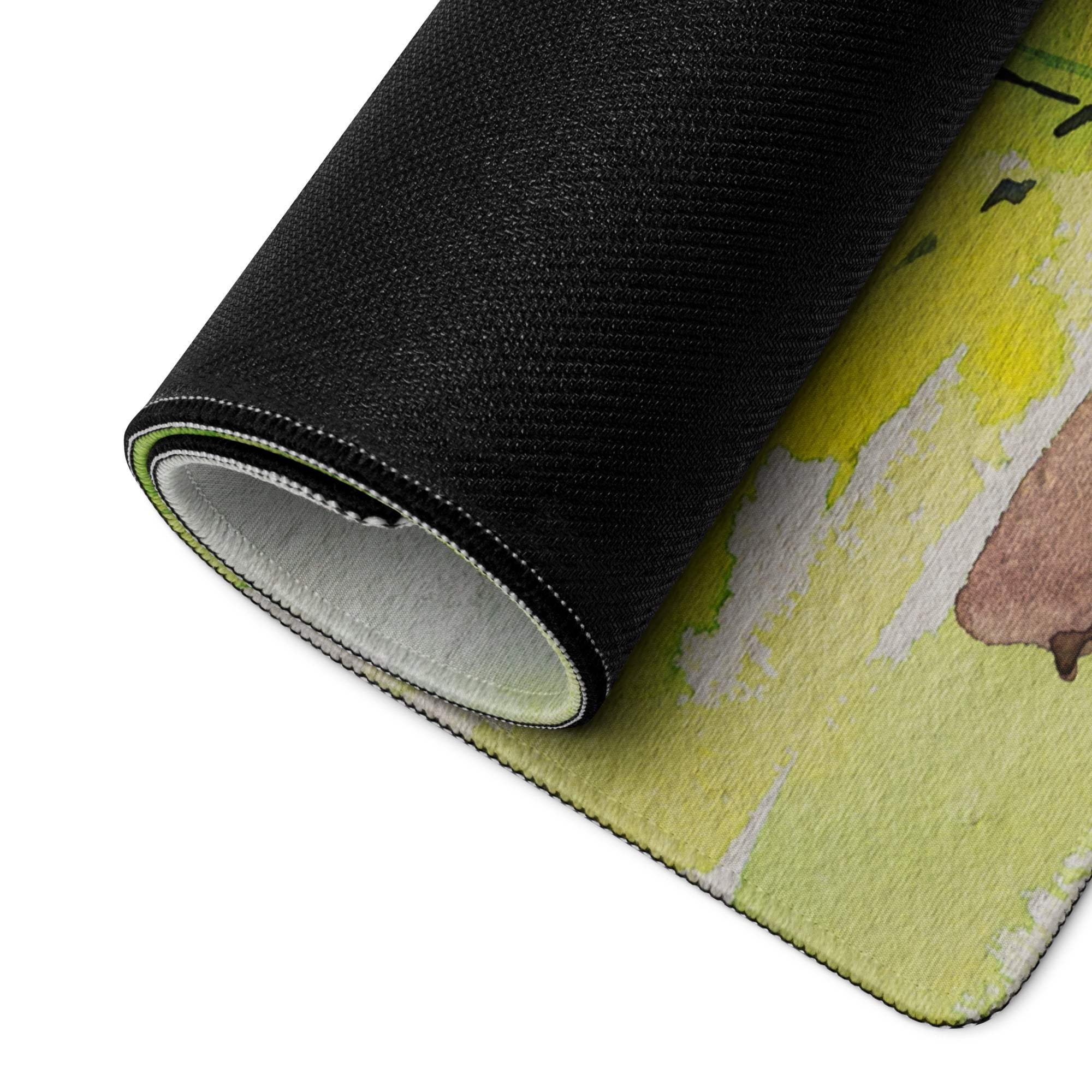 Rolled-up black Pastel Watercolor Landscape gaming mouse pad in yellow pink hues