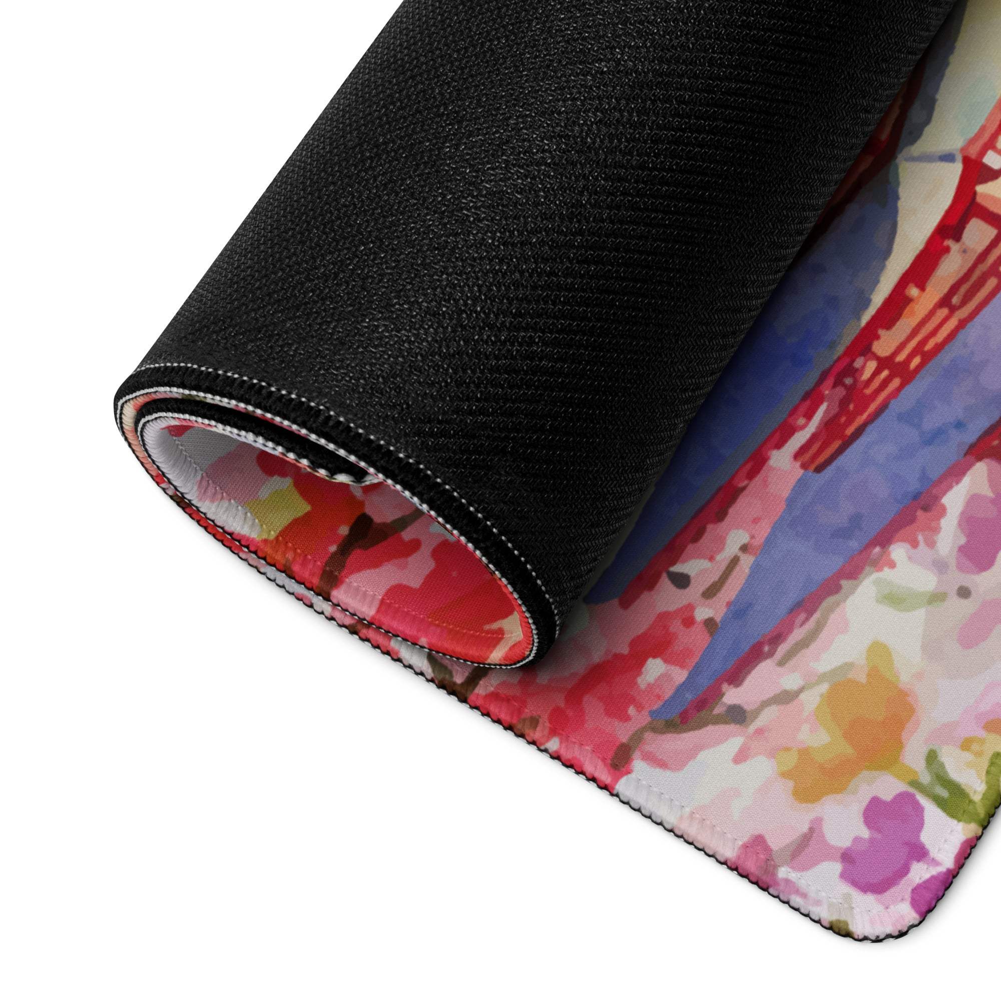 Rolled-up artistic cherry blossom gaming mouse pad with Golden Gate Bridge watercolor design