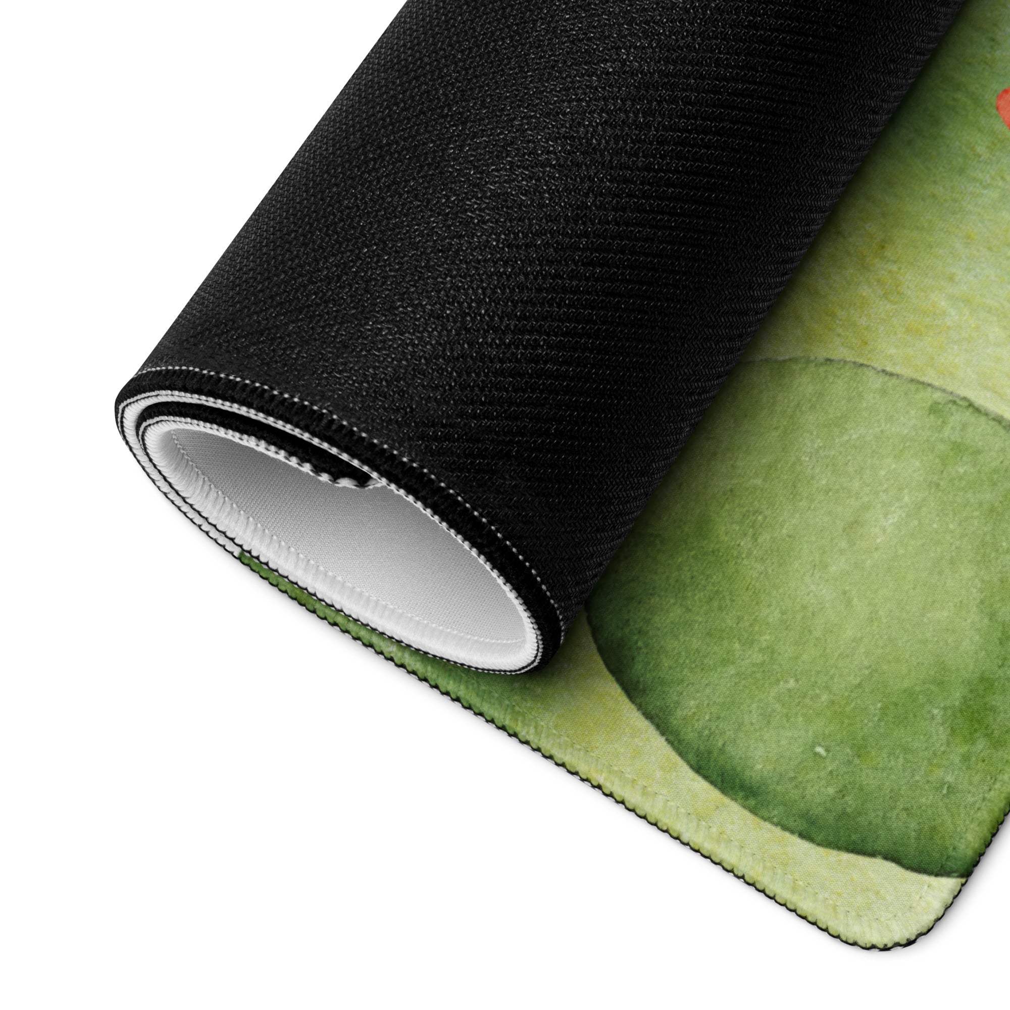 Rolled-up Whimsical Watercolor Castle green mouse pad with black textured outer layer