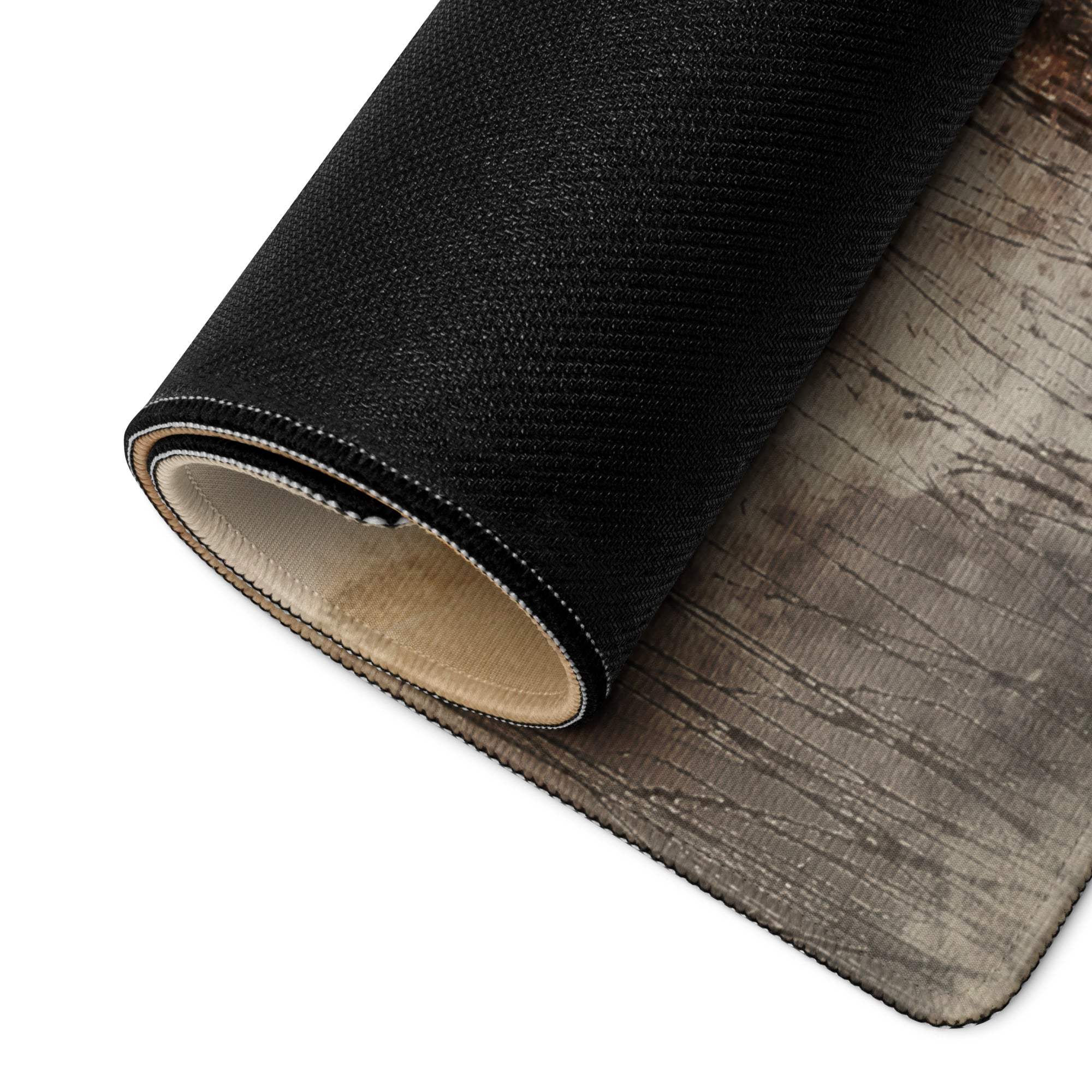 Back of watercolor landscape gaming mouse pad with black textured vinyl rug, gray wood-grain pattern, beige backing