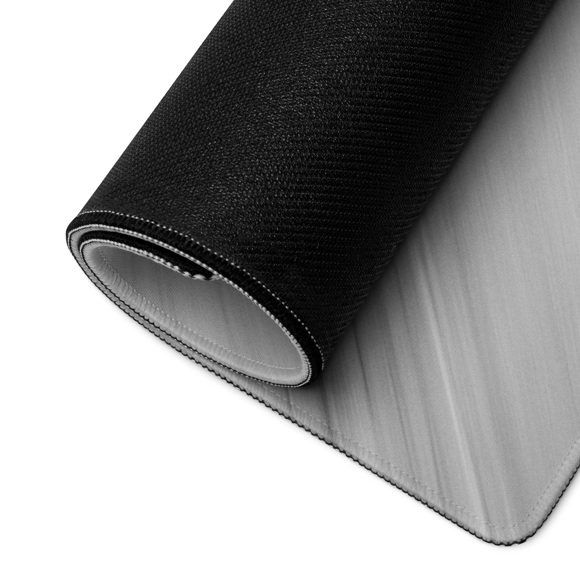 Back of brushed aluminum large gaming mouse pad with black textured fabric and gray lining