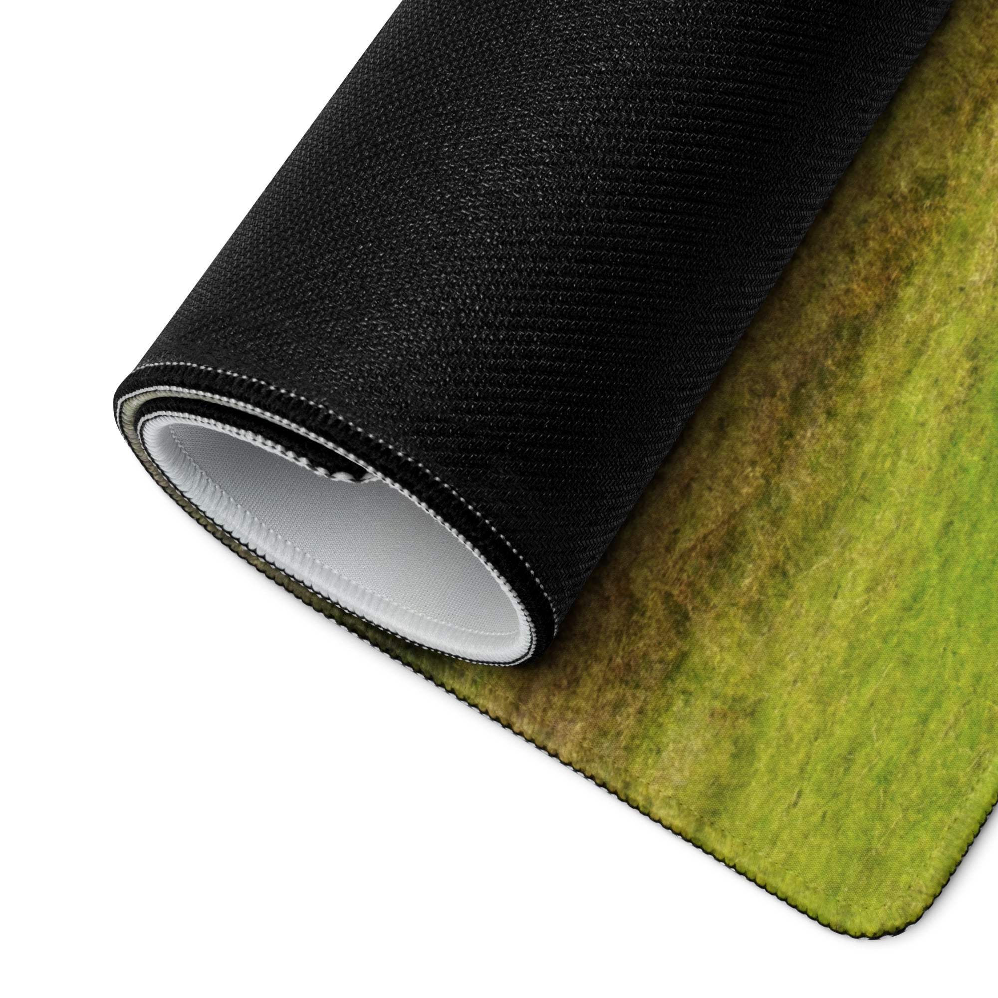 Rolled-up green black tree landscape gaming mousepad with rich texture