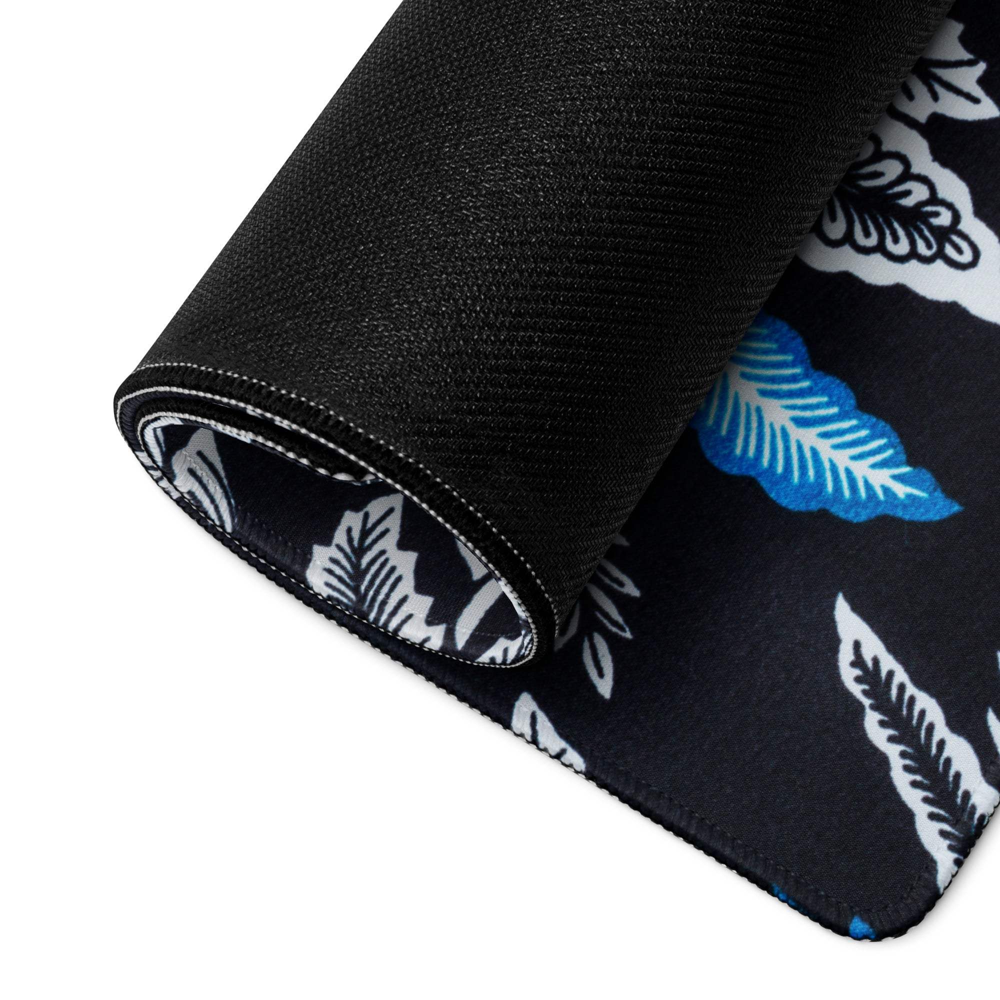 Black gaming mouse pad with white blue leaf pattern, non-slip stitched edges